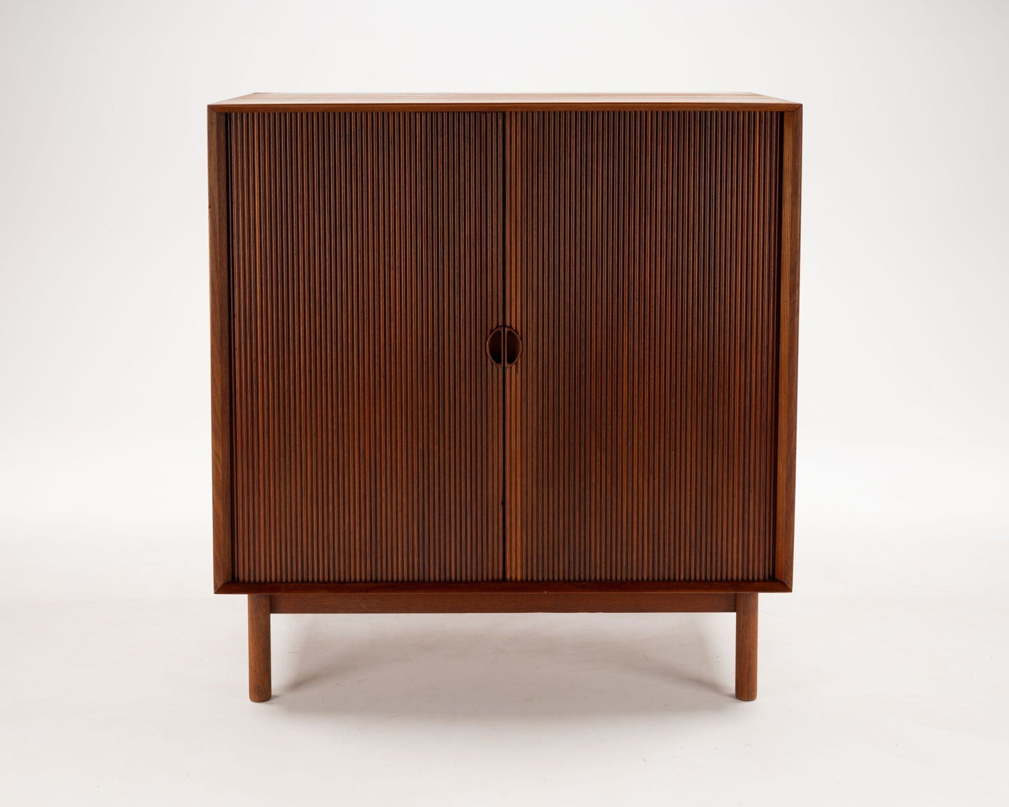 1950s Danish modern Peter Hvidt solid teak tambour door cabinet with minimalist design by Søborg Møbler