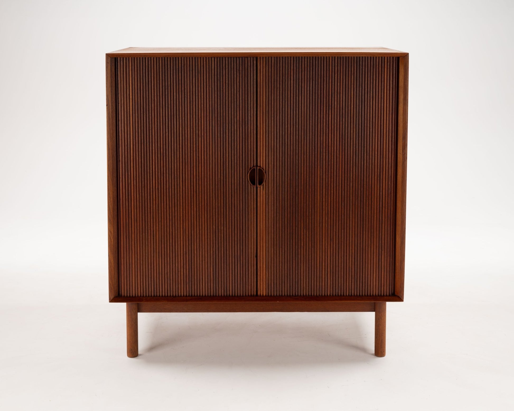 1950s Danish modern Peter Hvidt solid teak tambour door cabinet with minimalist design by Søborg Møbler