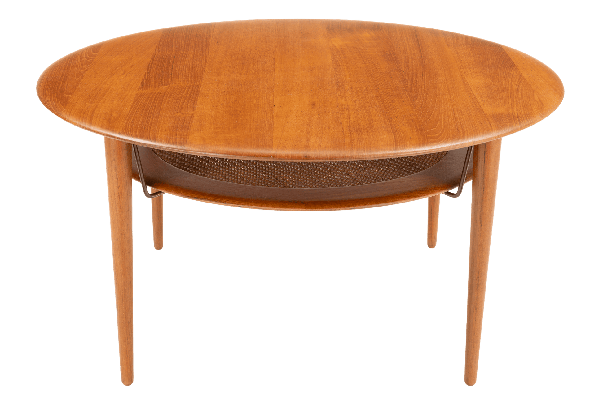 Peter Hvidt Teak Coffee Table Model FD-515 featuring a rounded teak wood top with smooth grain and a lower shelf supported by slender legs, exemplifying vintage Danish mid century modern furniture design.