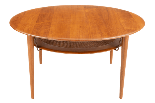 Peter Hvidt Teak Coffee Table Model FD-515 featuring a rounded teak wood top with smooth grain and a lower shelf supported by slender legs, exemplifying vintage Danish mid century modern furniture design.