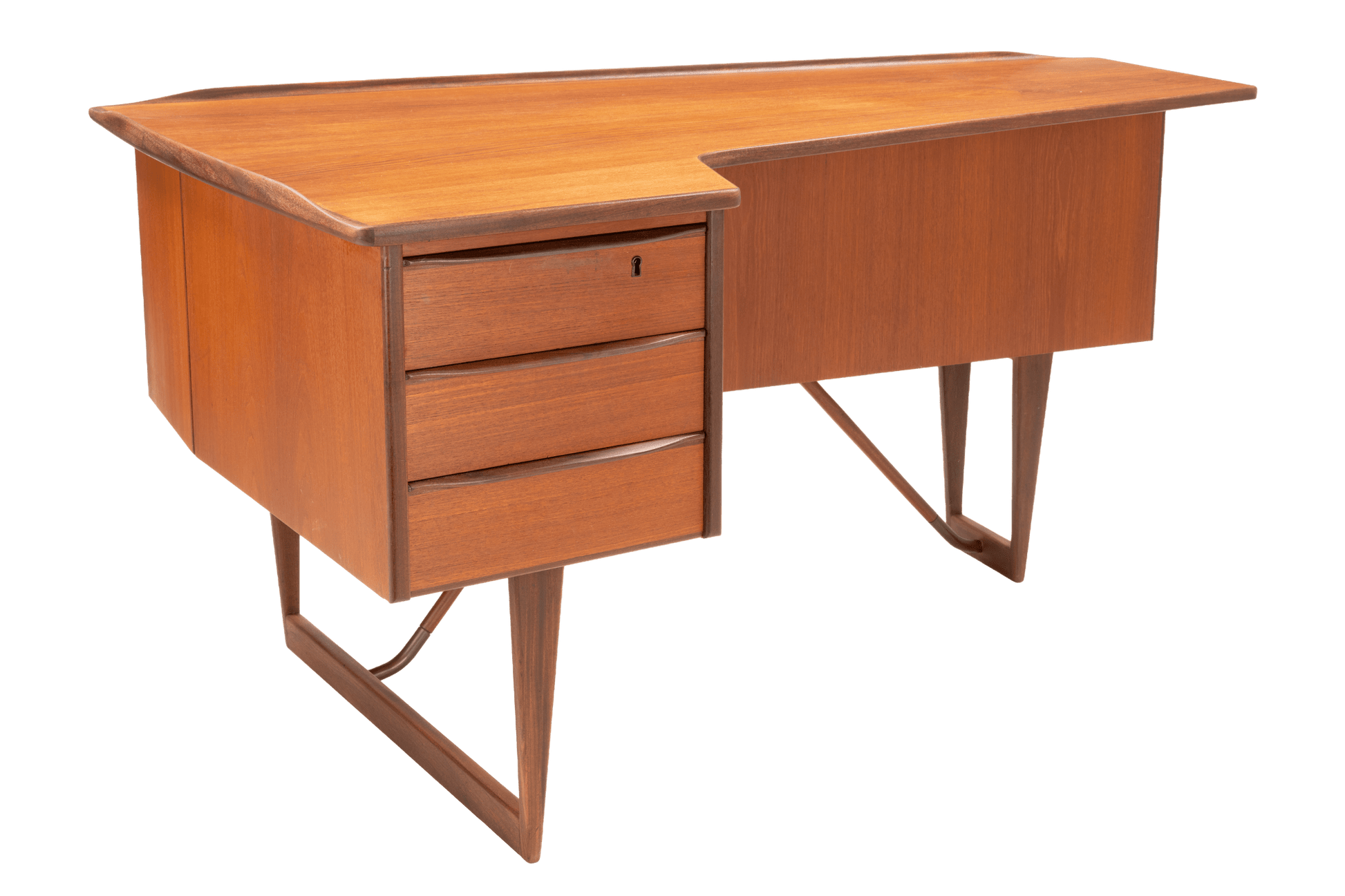 Asymmetrical teak writing desk with three drawers and sculptural angled legs in mid-century Danish design style