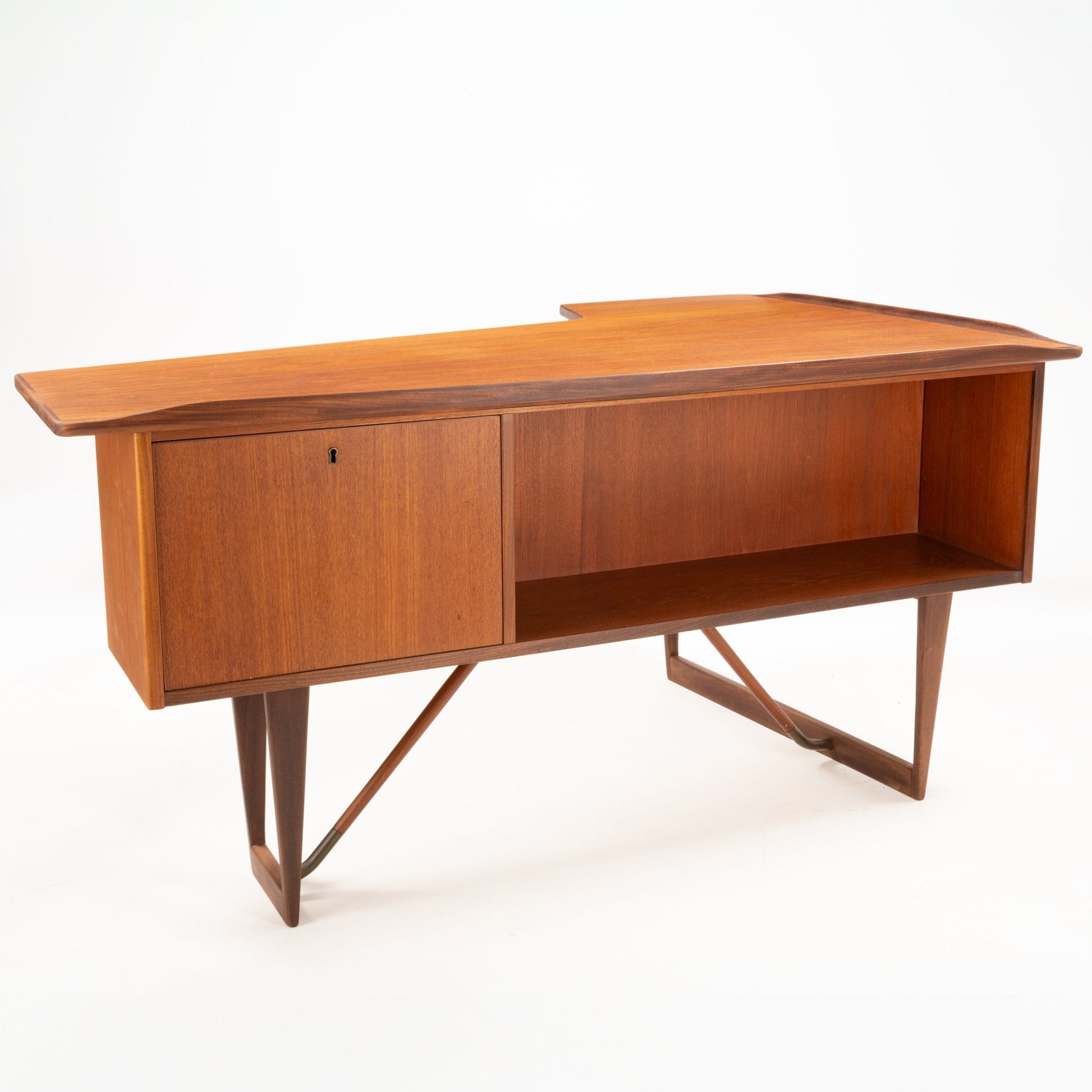1960s Danish teak writing desk with sculptural asymmetrical boomerang top, storage cabinet, and open shelf on geometric legs