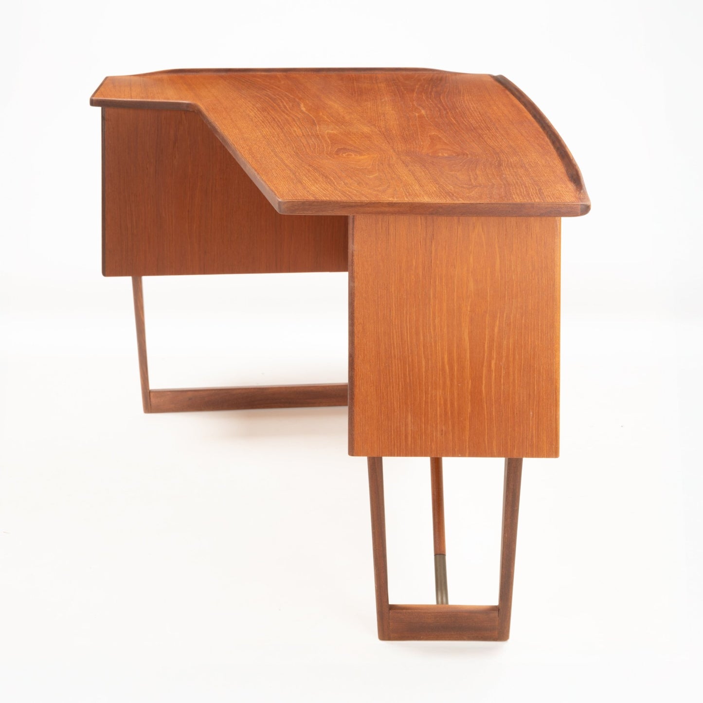 1960s Danish teak writing desk with distinctive oversized asymmetrical boomerang top and open geometric leg frame