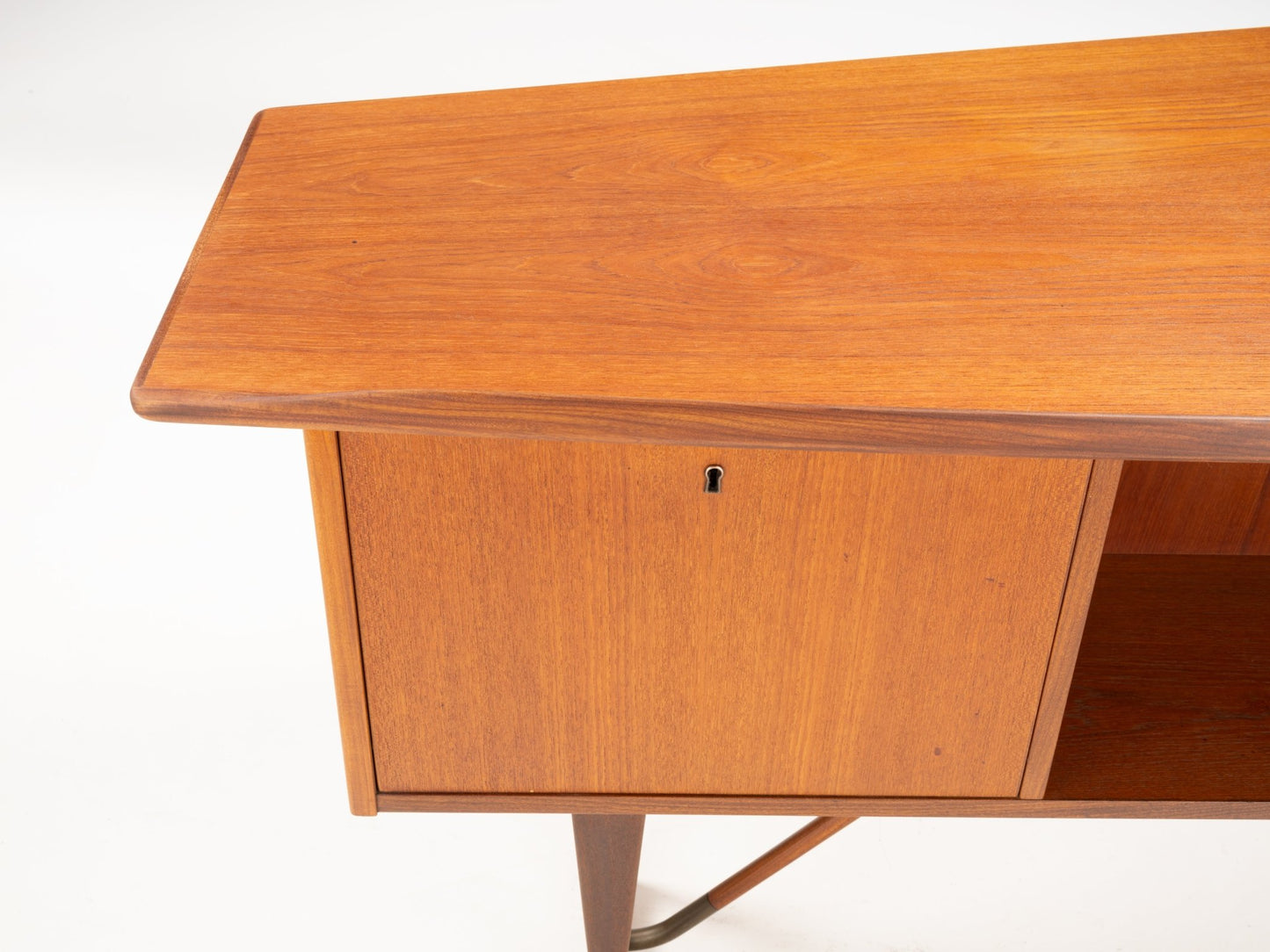 1960s Danish teak writing desk by Peter Løvig Nielsen with asymmetrical boomerang-shaped top and wooden storage cabinet
