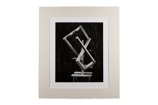 Black and white abstract photograph with hand manipulation, featuring geometric shapes and a neutral matting