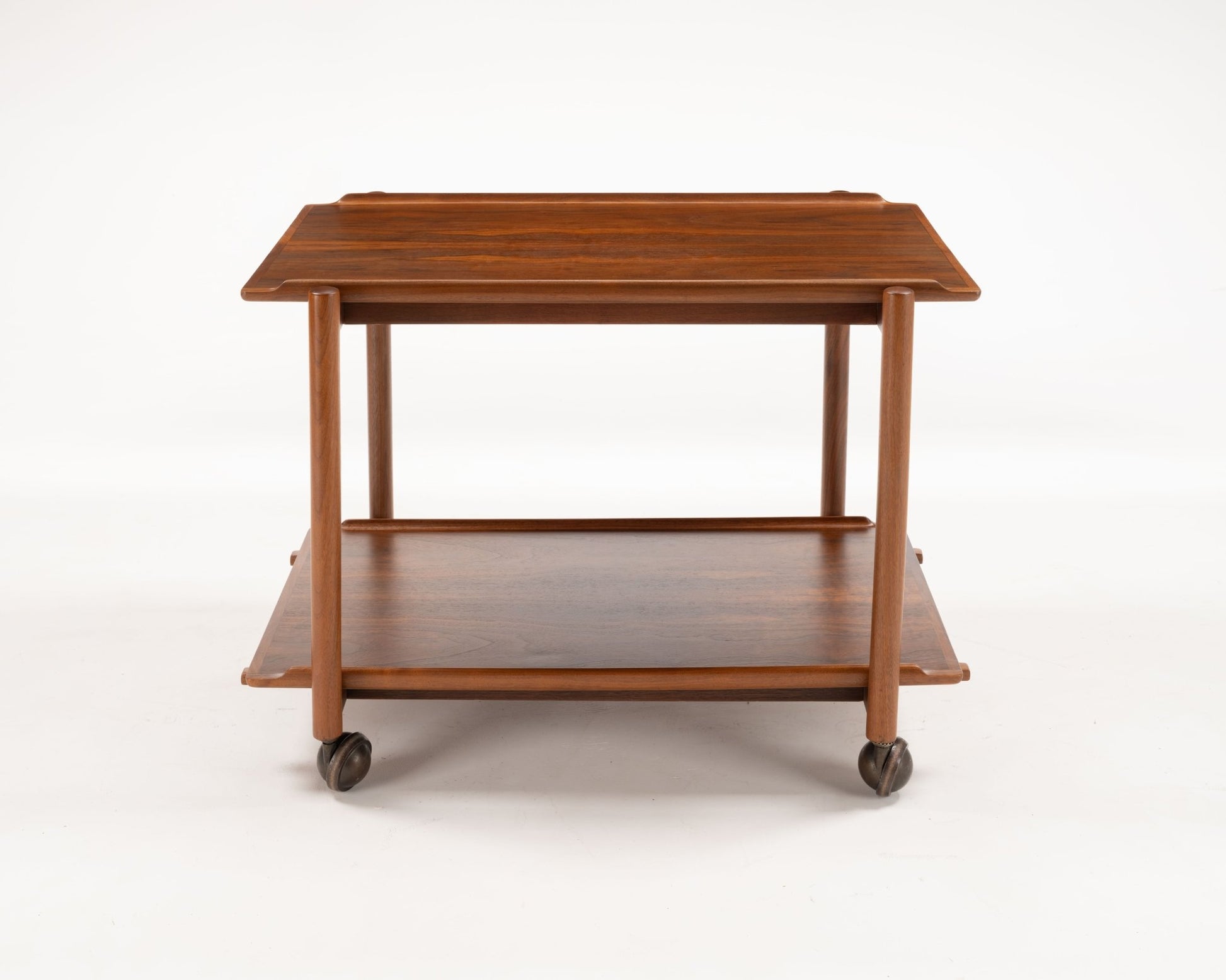 Poul Hundevad teak bar cart from the 1950s with expandable sliding top and lower serving tray on casters