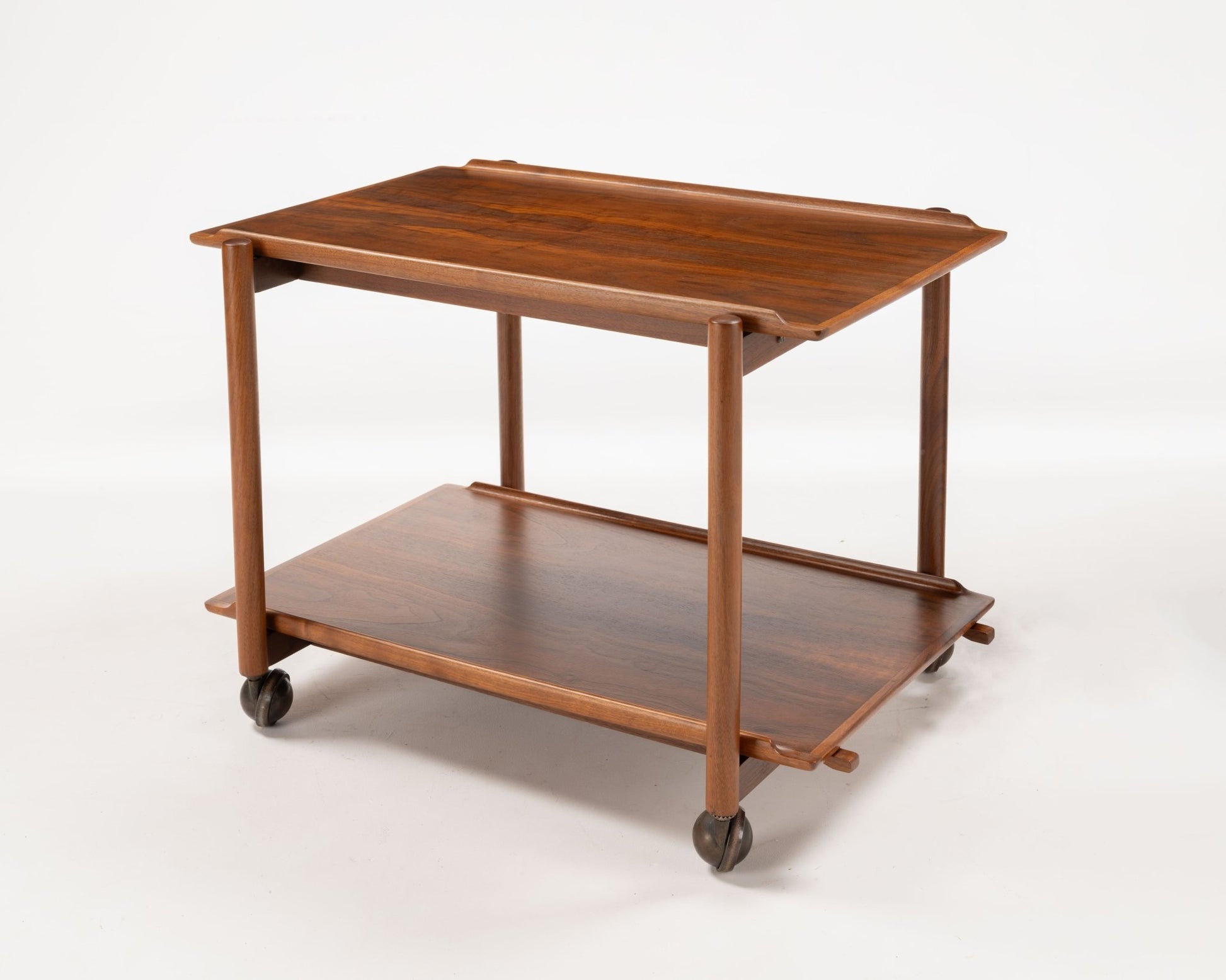 Poul Hundevad teak bar cart from the 1950s with expandable sliding top and lower serving tray on casters