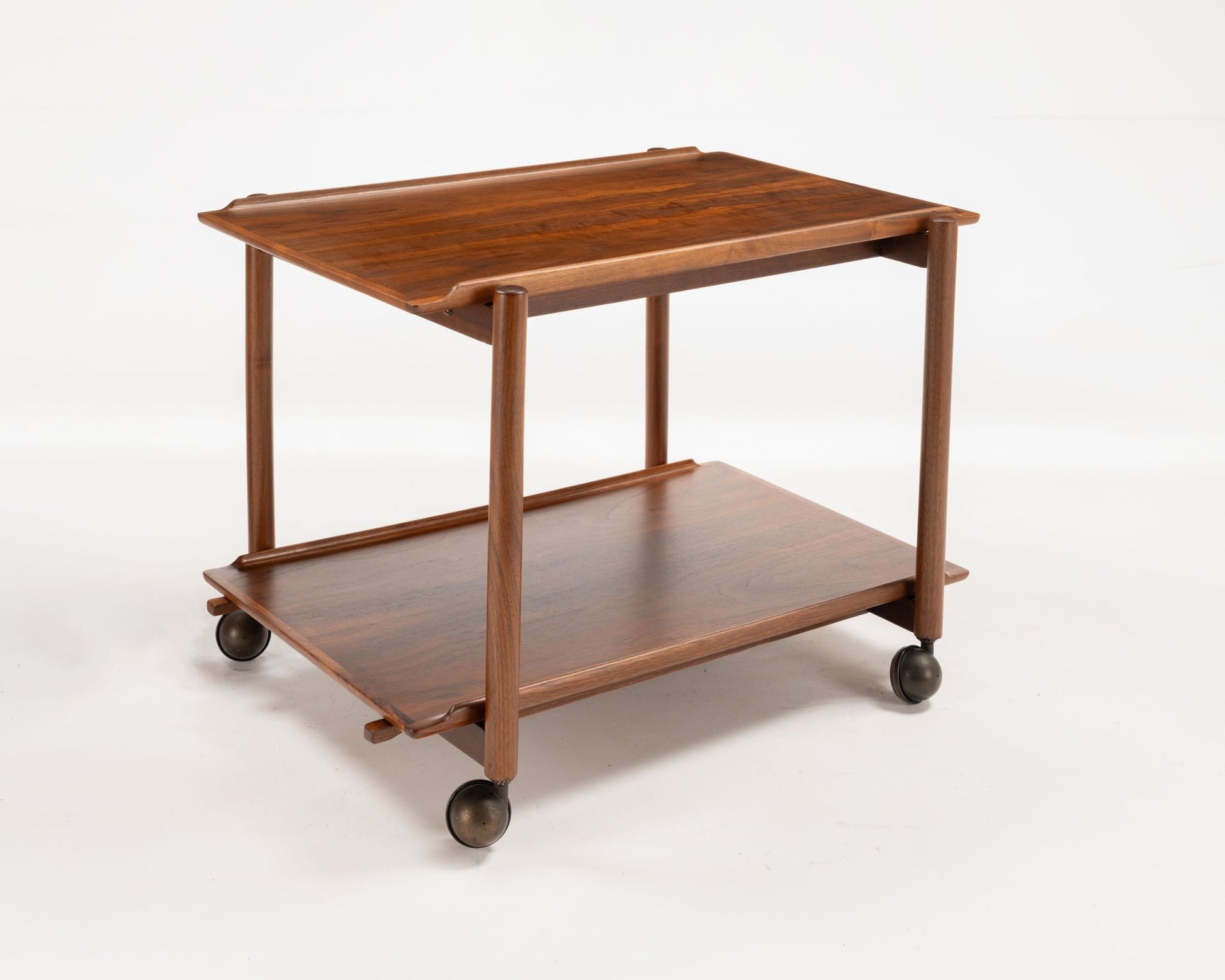 Poul Hundevad teak bar cart from 1950s Denmark with expandable sliding top and caster wheels for serving or storage