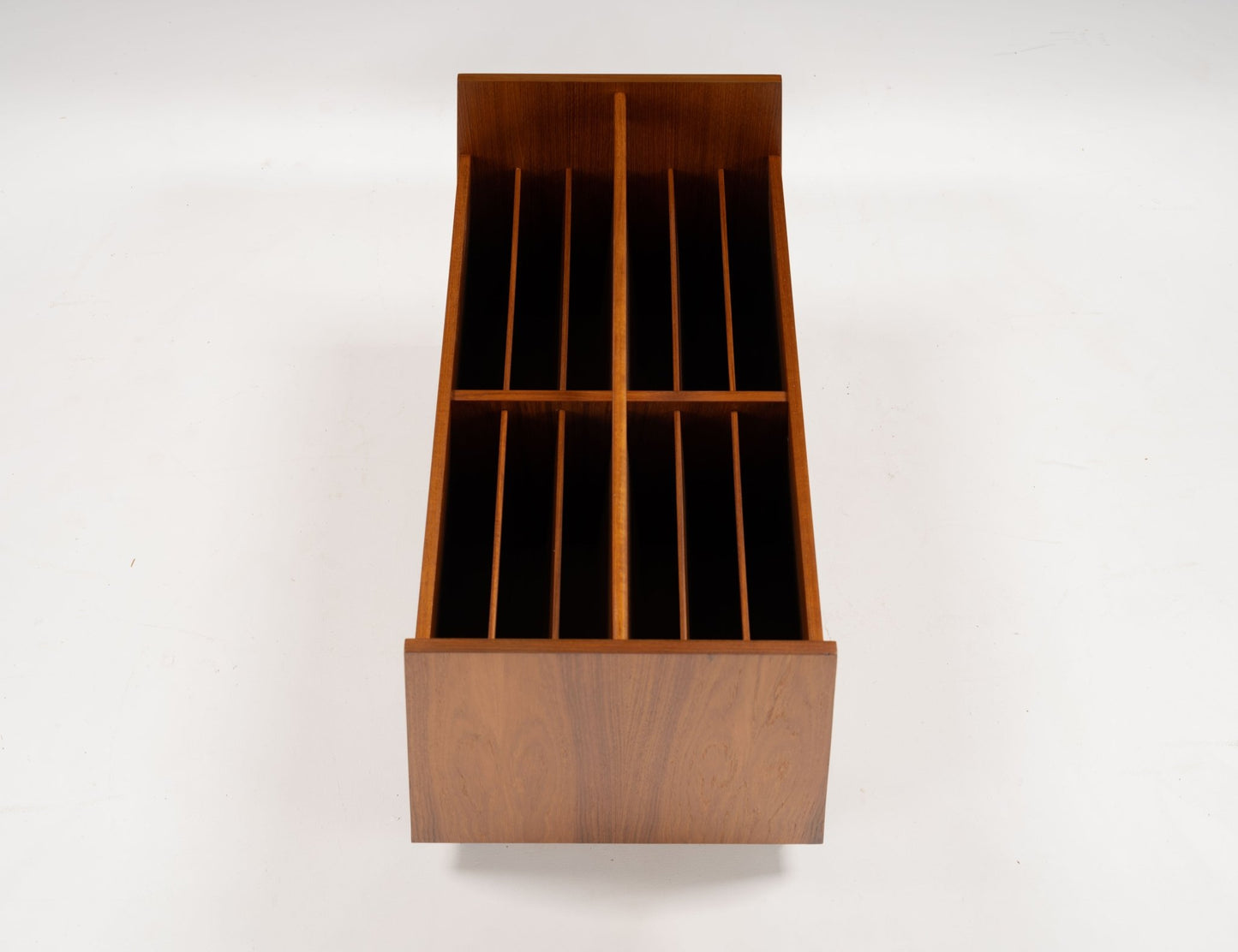 Mid-century modern double-wide teak record and magazine caddy with internal dividers and castor wheels.