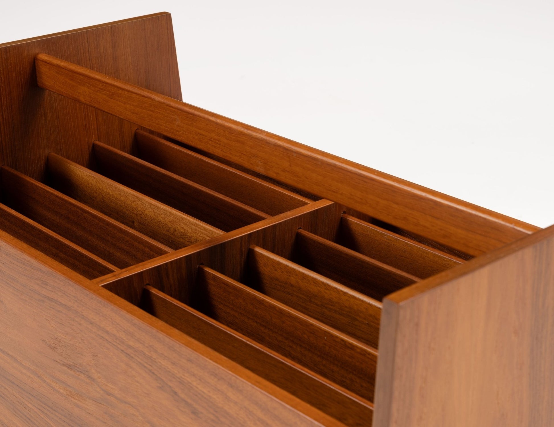 Double-wide mid-century modern teak record and magazine caddy with internal dividers and warm wood finish.