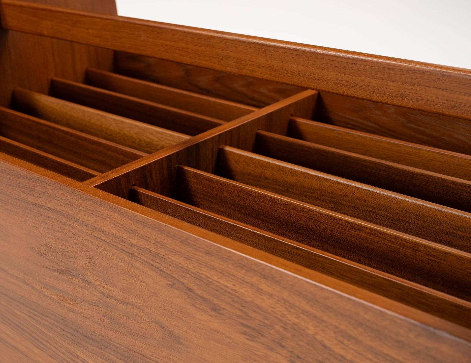 Double-wide mid-century modern teak record and magazine caddy with internal dividers and warm wood grain finish