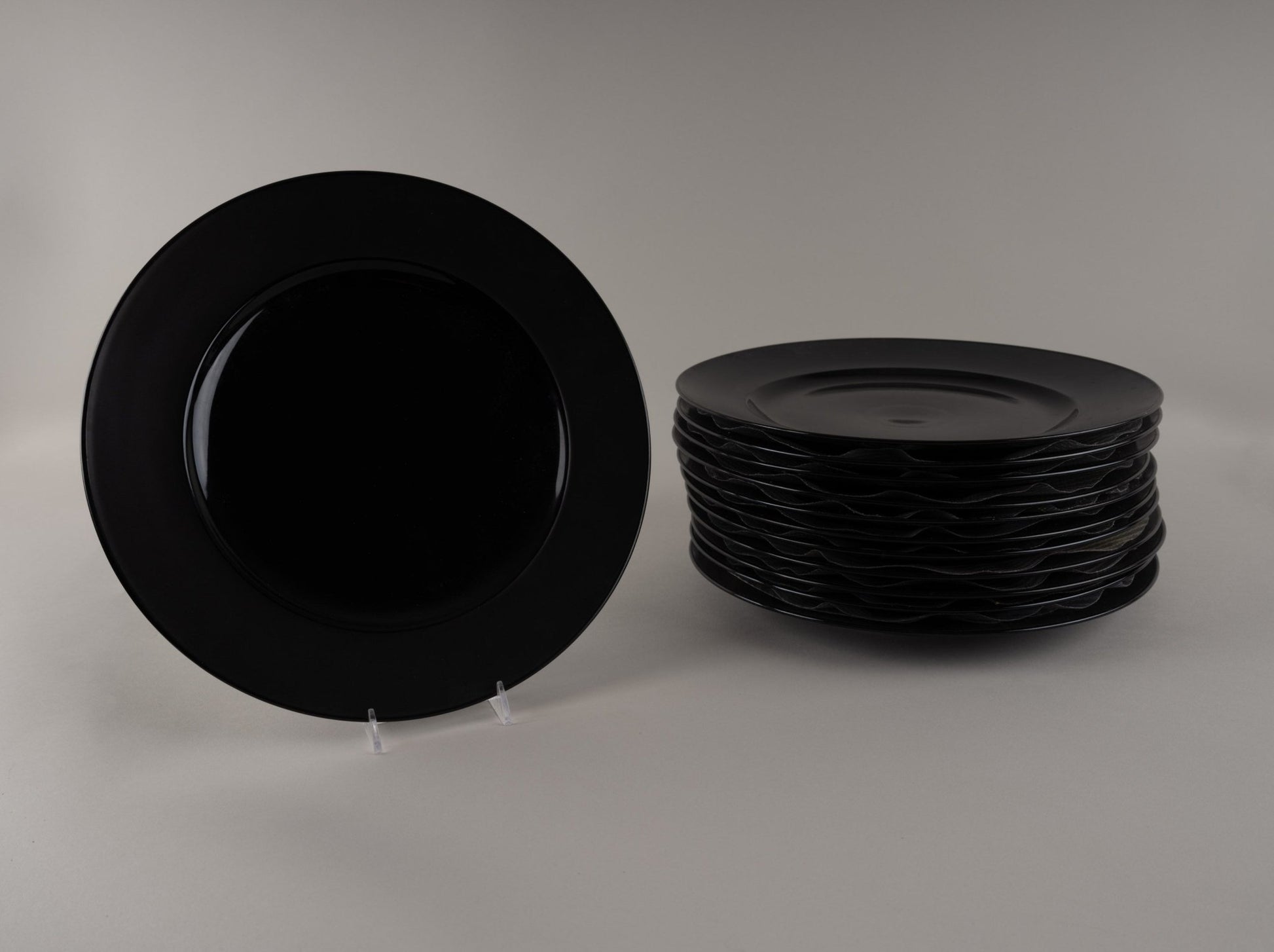 Set of Rosenthal "Charcoal" black eggshell china plates designed by Raymond Loewy, produced 1955-1965, stacked