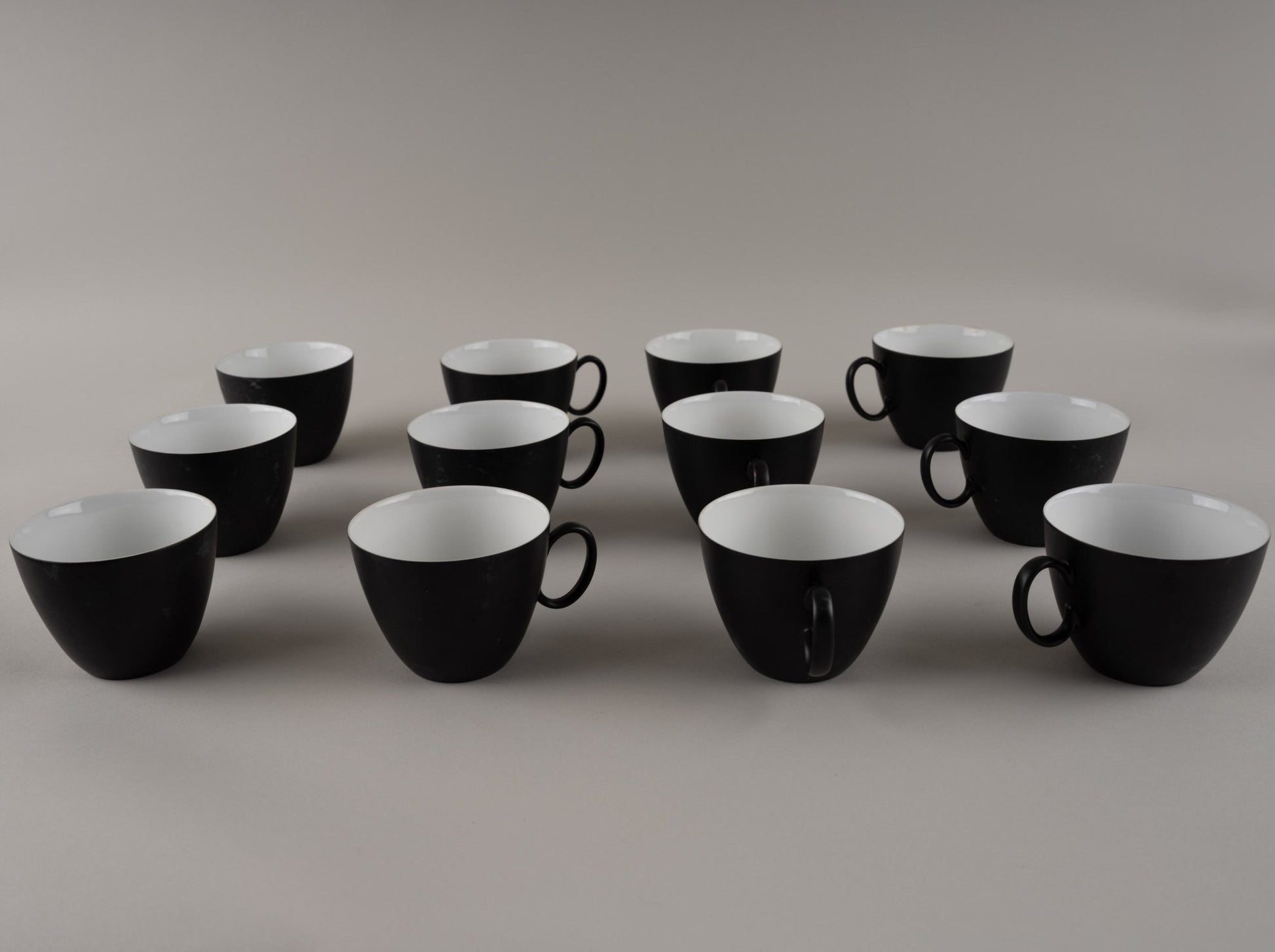 Set of eleven Rosenthal "Charcoal" eggshell black china cups designed by Raymond Loewy from the 1950s-1960s.