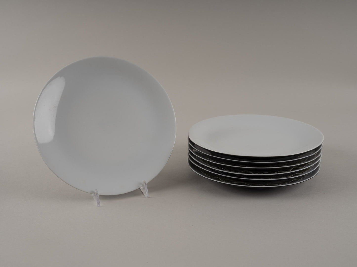 Set of seven Rosenthal "Charcoal" eggshell black china plates designed by Raymond Loewy from the 1950s-60s.