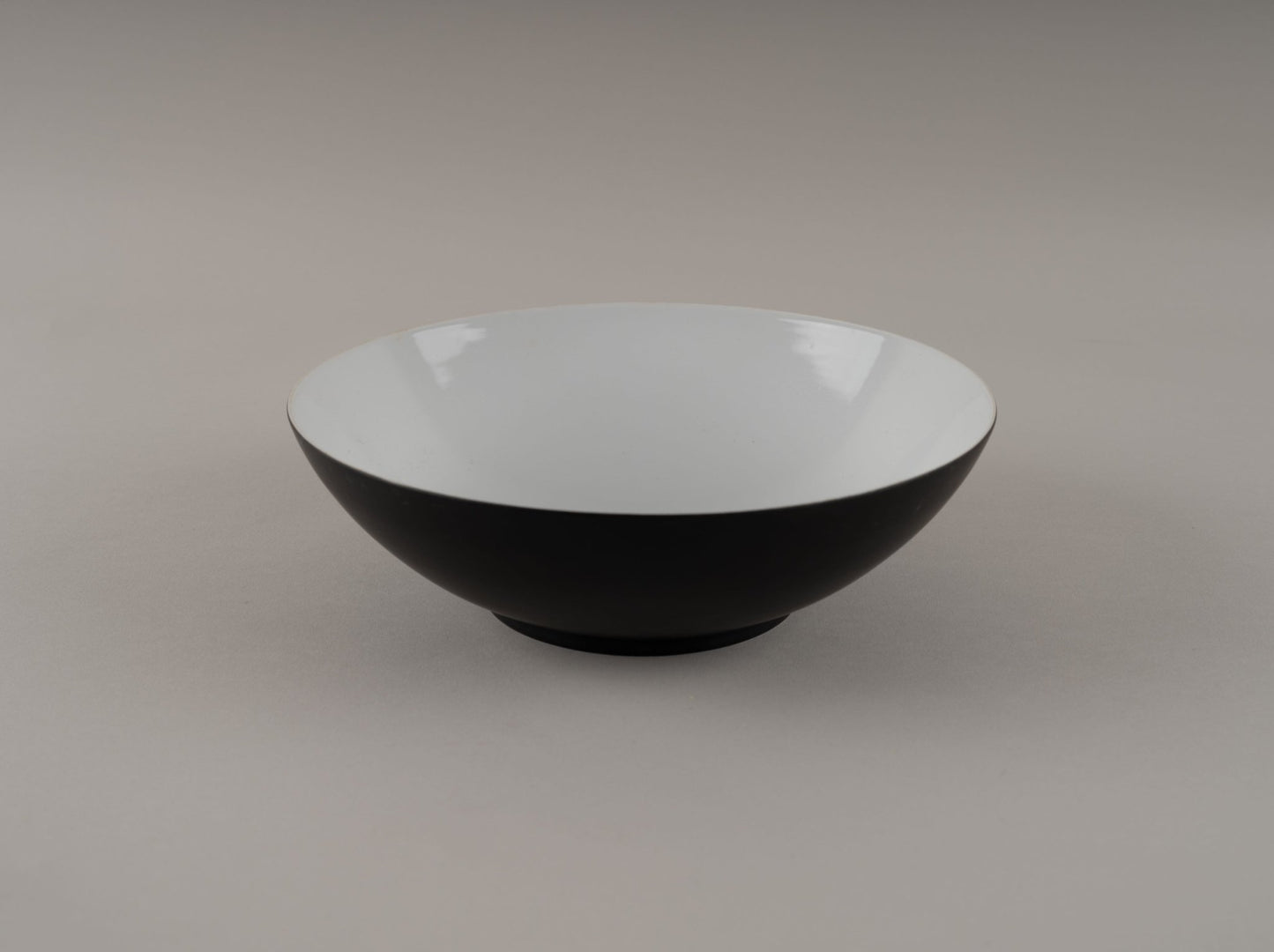 Eggshell black Raymond Loewy Rosenthal "Charcoal" china bowl from 1950s with glossy interior and matte exterior finish