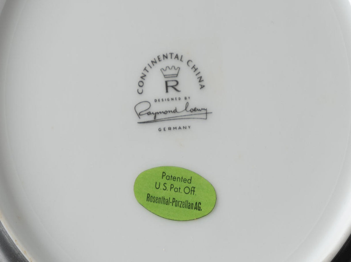 Bottom view of Rosenthal "Charcoal" china plate with Raymond Loewy signature and patent sticker from Germany