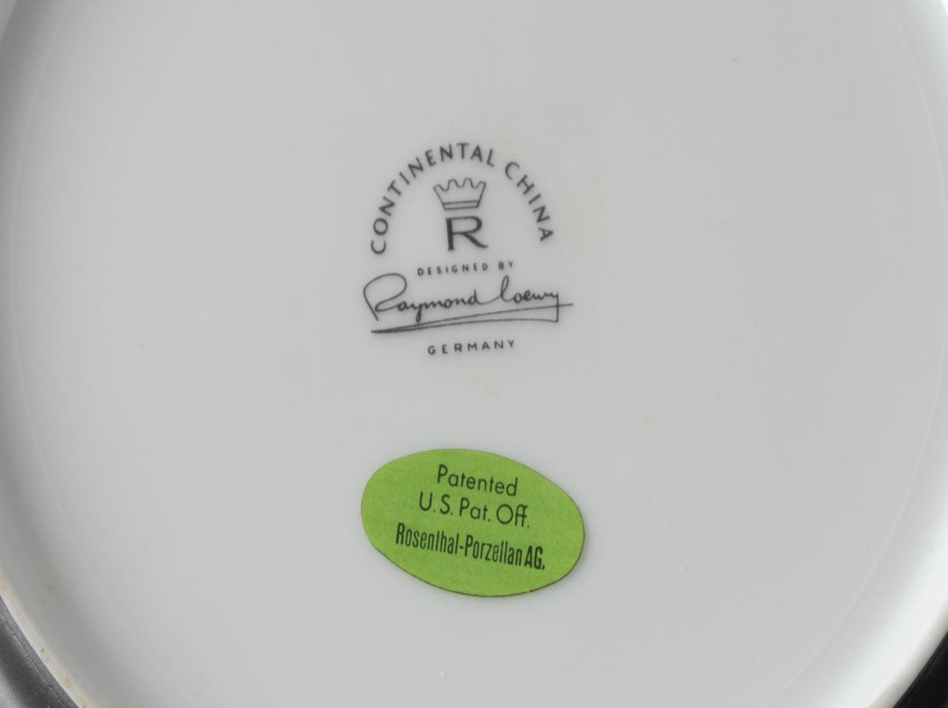 Bottom view of Rosenthal "Charcoal" china plate with Raymond Loewy signature and patent sticker from Germany