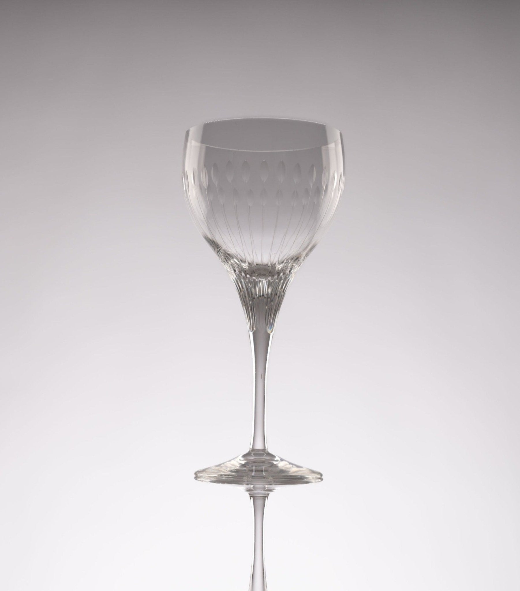 Single Rosenthal Lotus Cut crystal stemware glass from 1960s Germany with faceted-oval petal design on stem and bowl