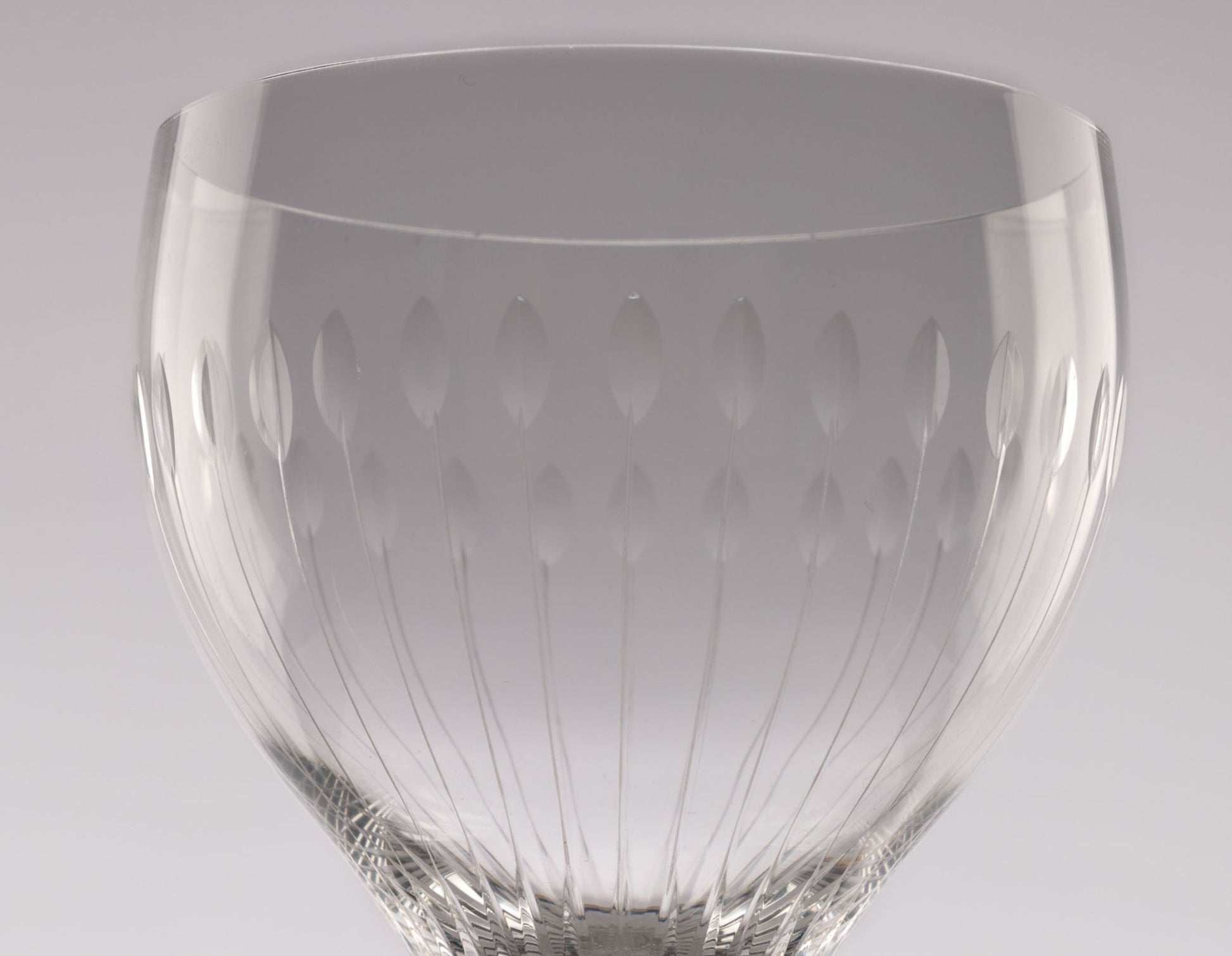 Close-up of Rosenthal Lotus Cut crystal stemware with faceted oval petal design from 1960s Germany.