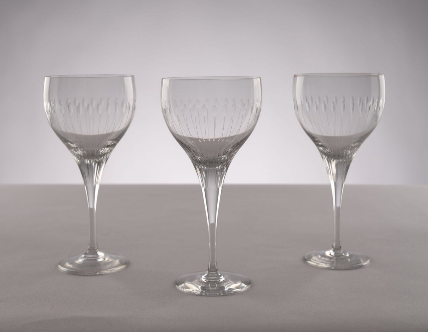 Set of three Rosenthal Lotus Cut crystal stemware glasses from 1960s with distinctive faceted petal-like oval cuts