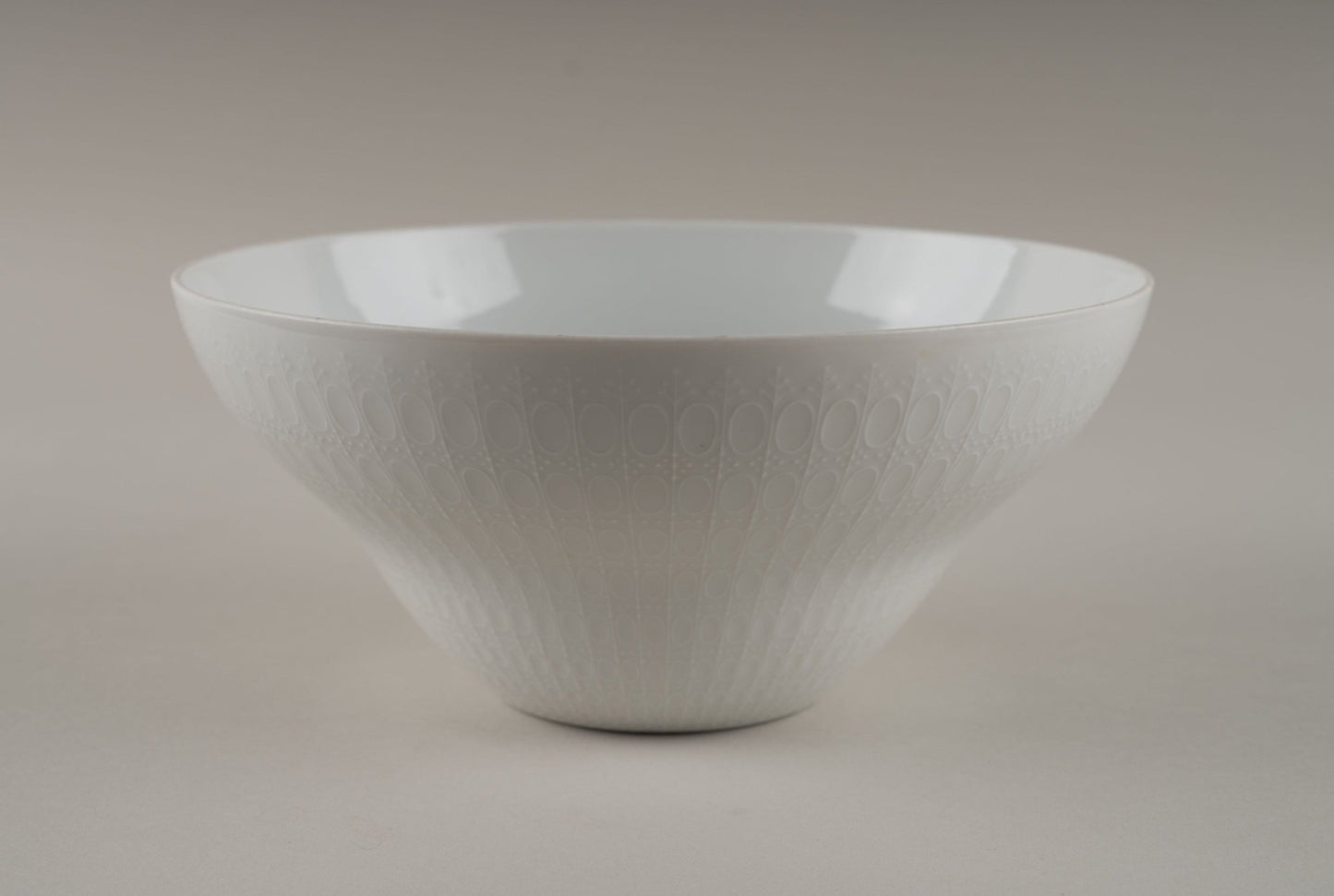 Rosenthal "Romance" white porcelain bowl with embossed oval and dot pattern designed by Bjorn Wiinblad.