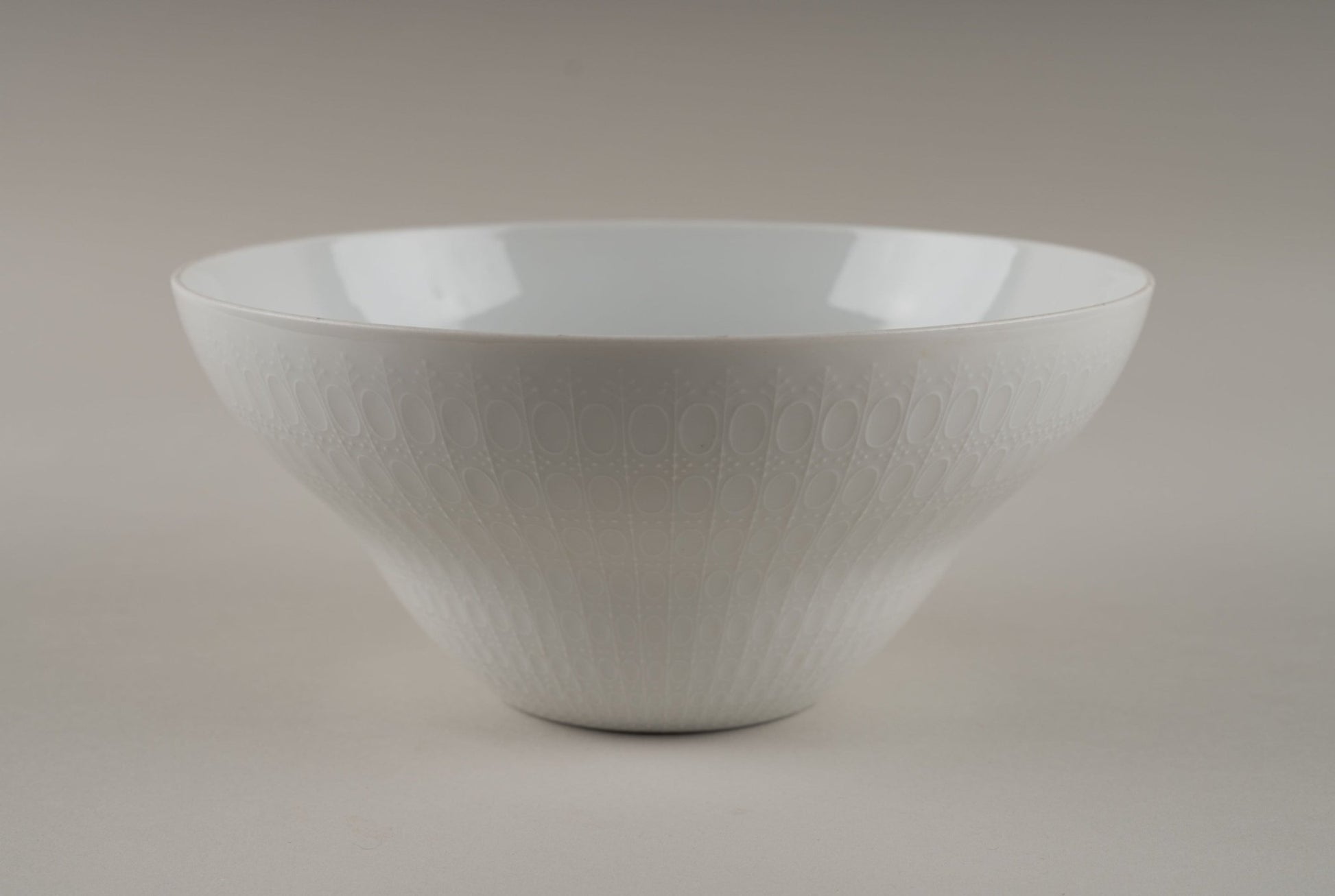 Rosenthal "Romance" white porcelain bowl with embossed oval and dot pattern designed by Bjorn Wiinblad.