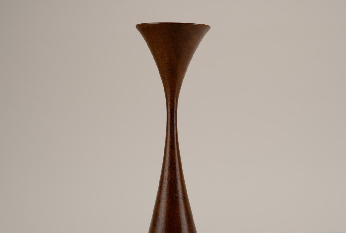 Pair of Rude Osolnik woodturned candlestick holders with a sleek clinched design from the United States.