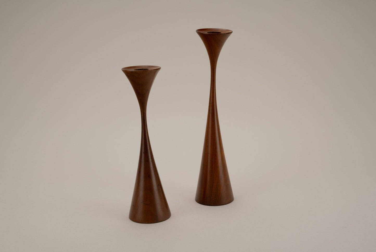 Pair of Rude Osolnik woodturned clinched candlestick holders with elegant tapered mid-century modern design