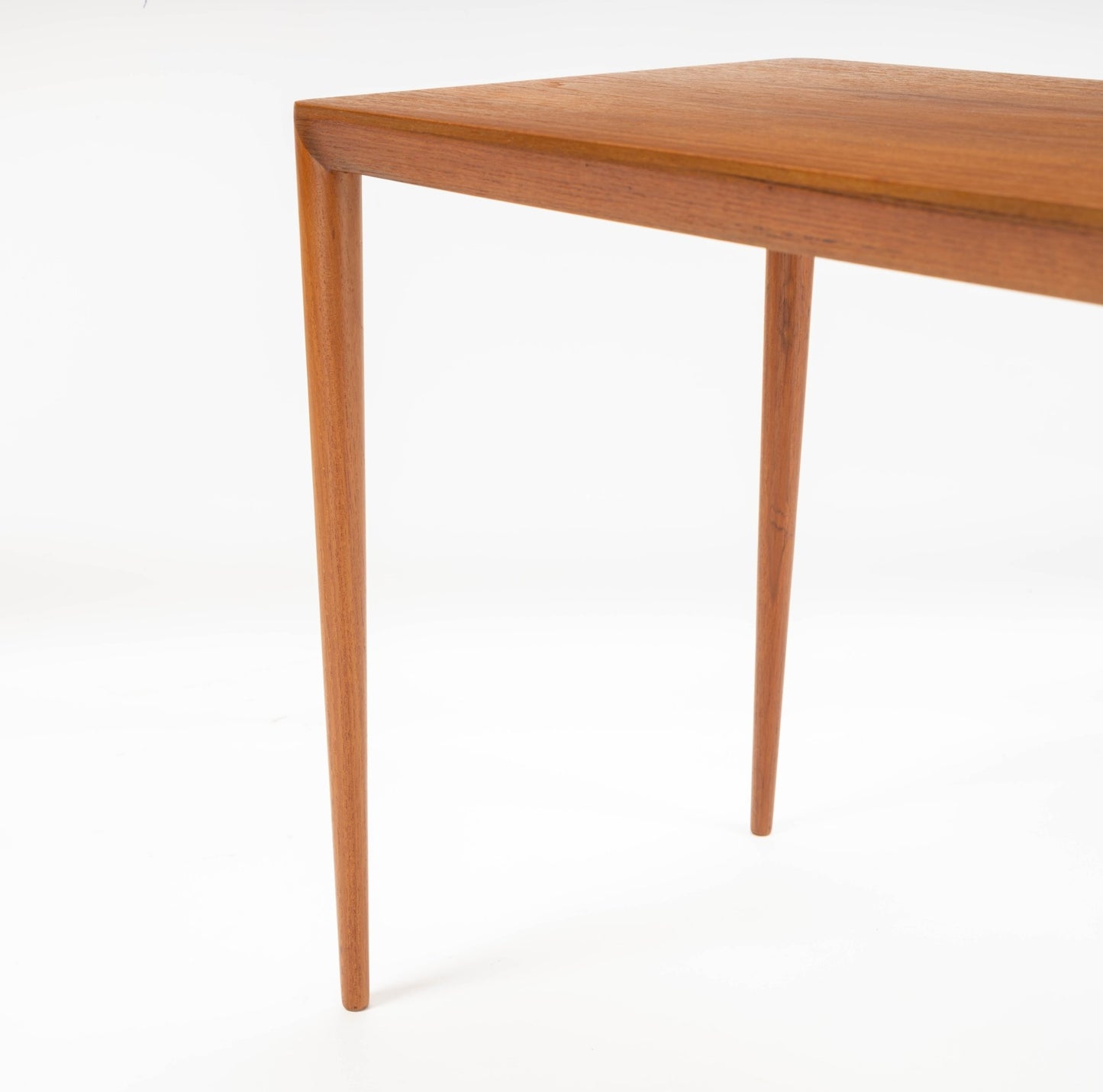 Teak side table in the manner of Severin Hansen with tapered legs and beveled edges, showcasing 1960s Danish design.