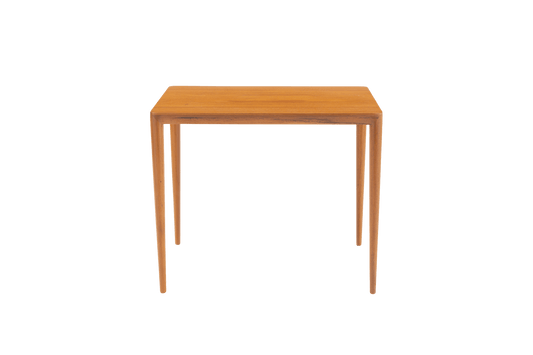 Mid-century modern teak side table in the manner of Severin Hansen with beveled edges and tapered round legs.