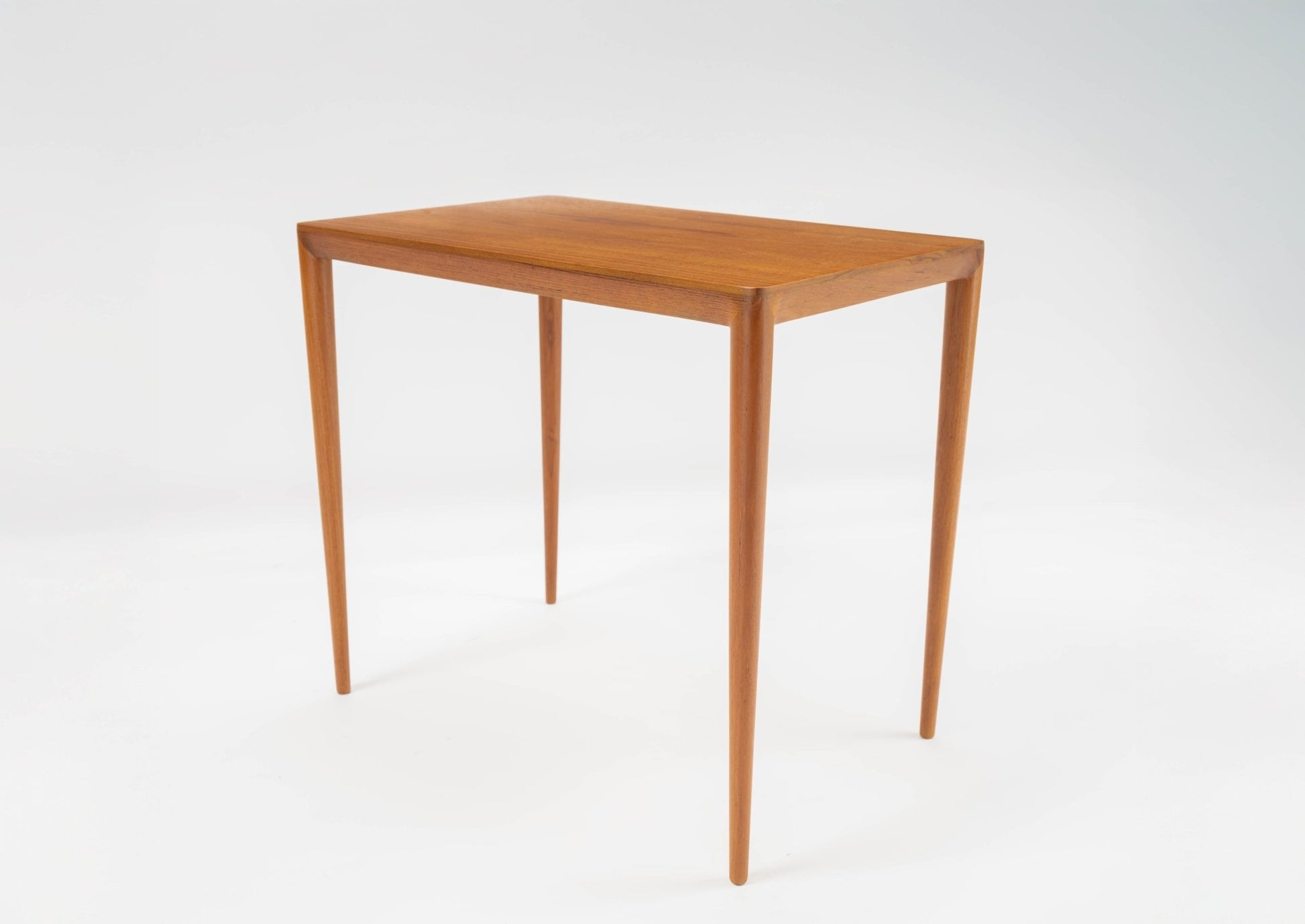 Mid-century modern teak side table with bevelled edges and tapered legs, inspired by Severin Hansen circa 1960s.
