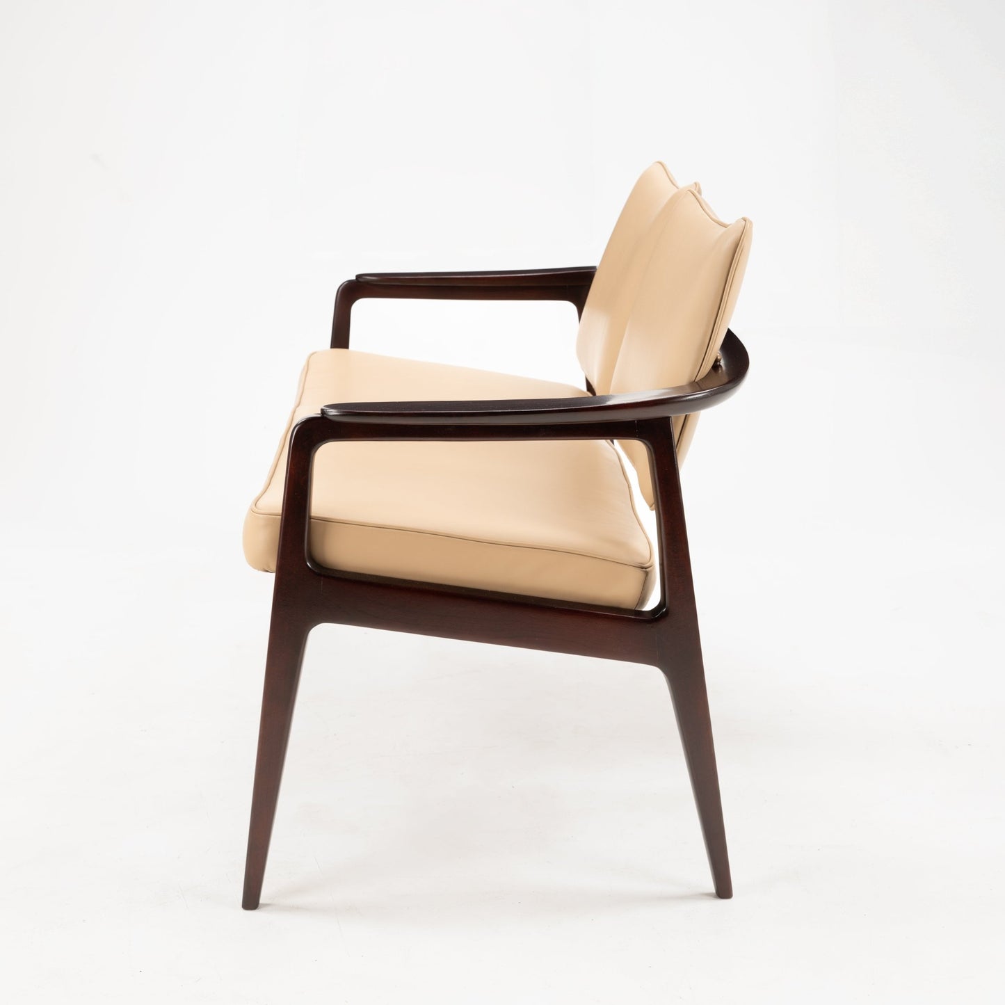 Sigvard Bernadotte Model FD132 Sofa with sleek dark wooden frame and smooth beige leather cushions, showcasing a refined silhouette and timeless mid century modern seating craftsmanship.