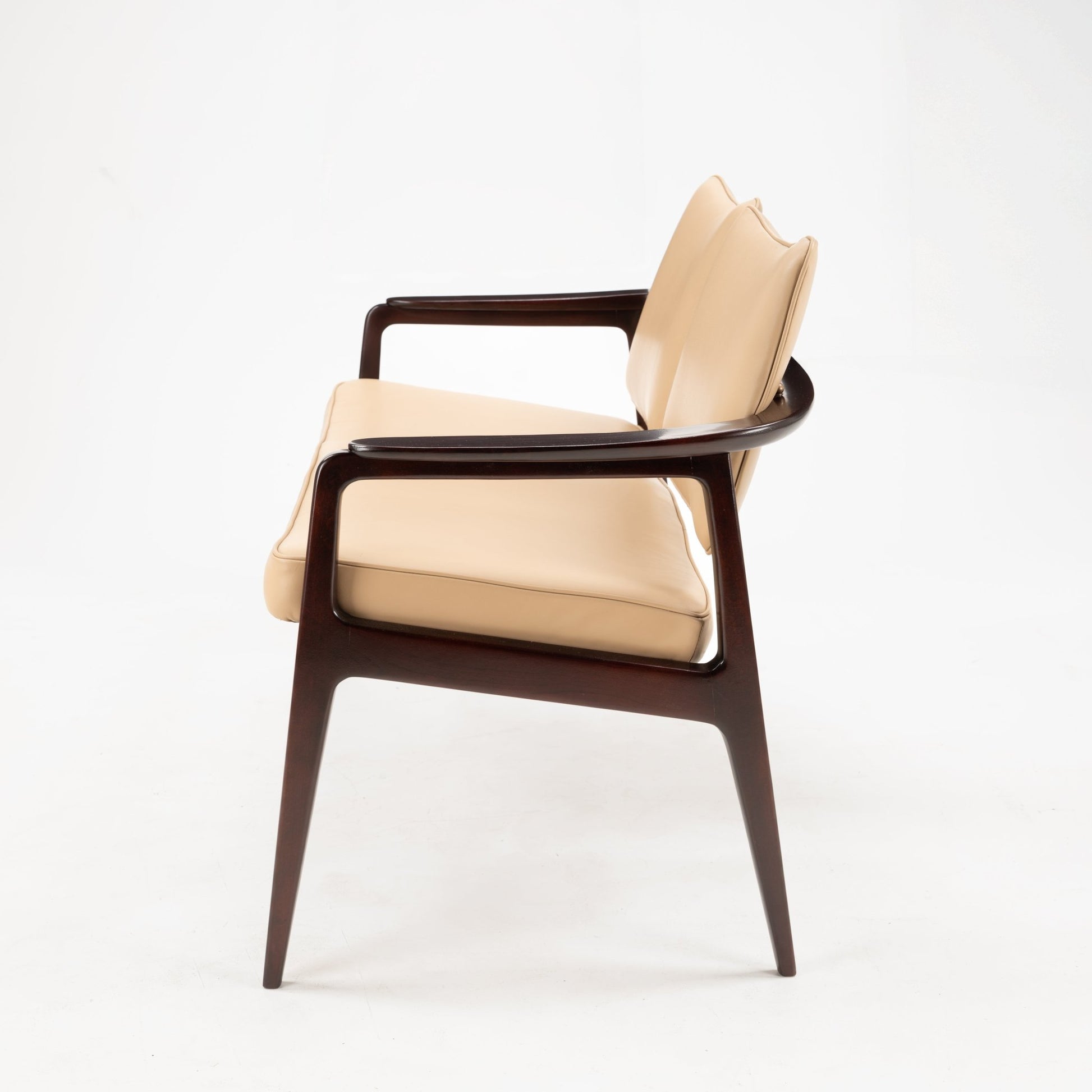 Sigvard Bernadotte Model FD132 Sofa with sleek dark wooden frame and smooth beige leather cushions, showcasing a refined silhouette and timeless mid century modern seating craftsmanship.