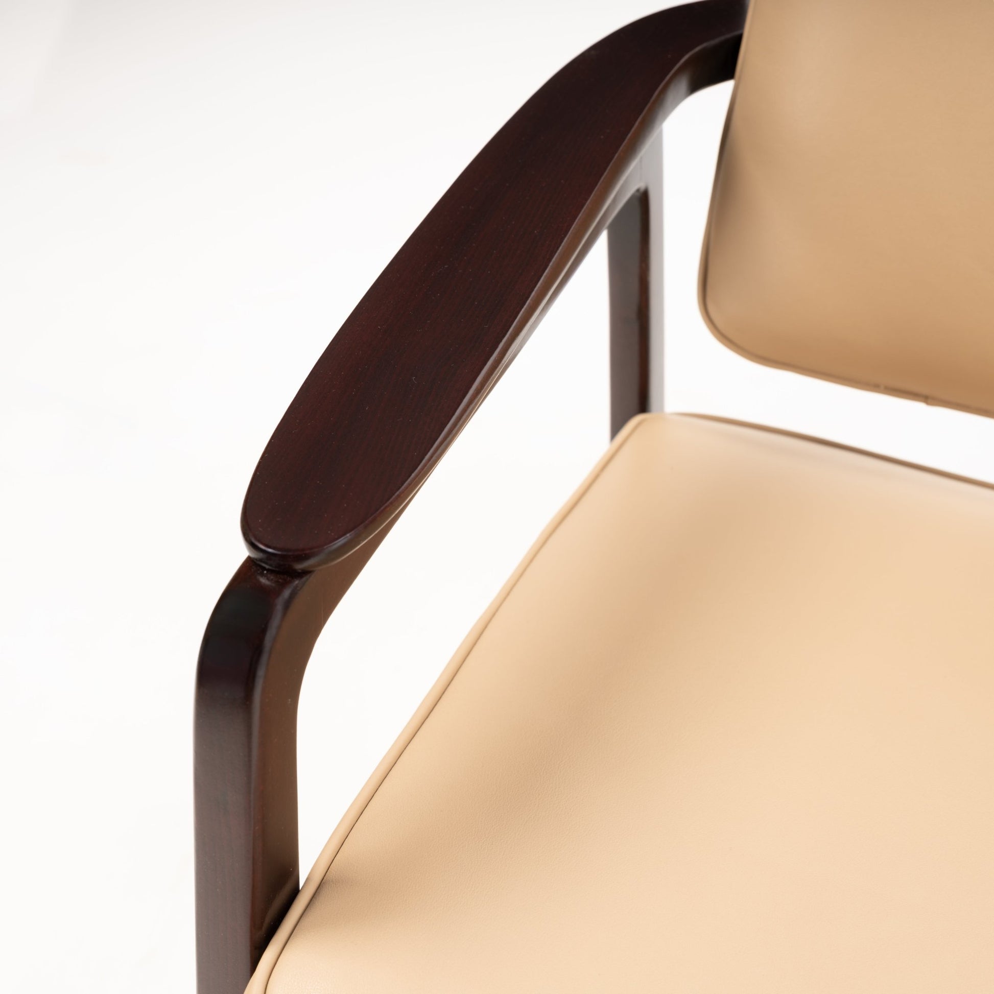 Sigvard Bernadotte Model FD132 Sofa featuring smooth beige leather seating with a dark wooden armrest and frame, highlighting refined craftsmanship in mid century modern furniture design.