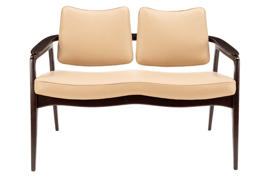 Sigvard Bernadotte Model FD132 Sofa featuring smooth beige leather upholstery with a gracefully curved seat and backrest, supported by a dark wooden frame, reflecting vintage Danish mid century modern seating design.
