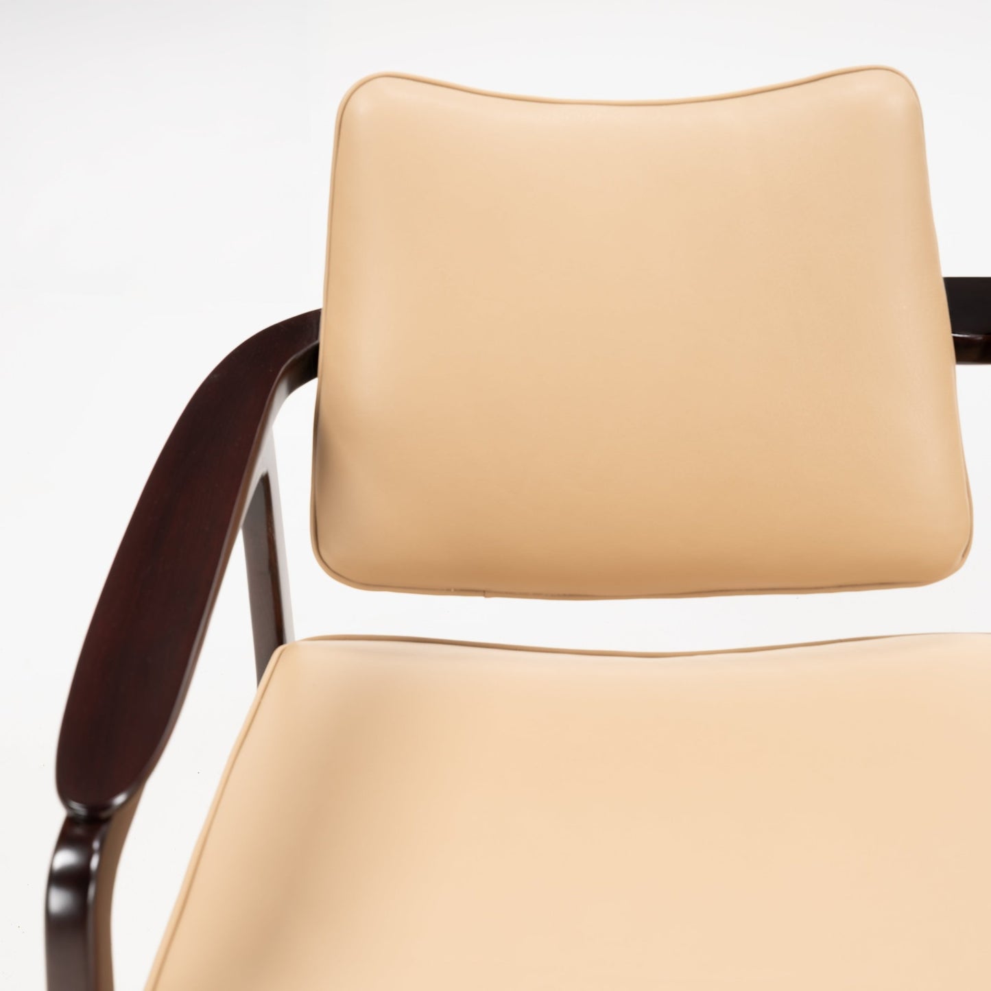 Sigvard Bernadotte Model FD132 Sofa with smooth tan leather cushions and gently curved backrest, supported by a dark wooden armrest, highlighting mid century modern seating design.