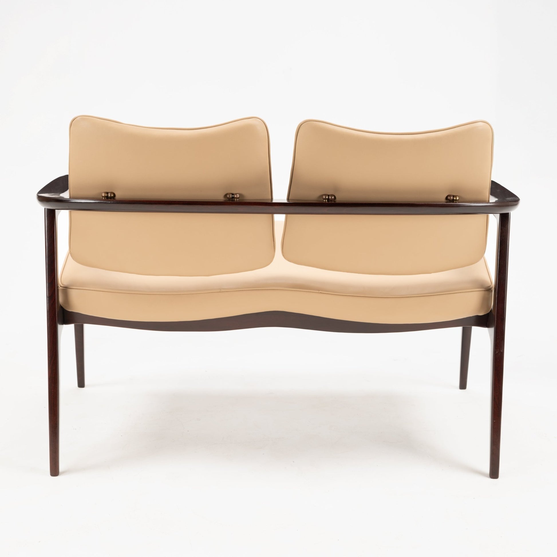 Sigvard Bernadotte Model FD132 Sofa viewed from the back, featuring a dark wooden frame with tapered legs and smooth beige leather cushions showcasing elegant mid century modern seating design.
