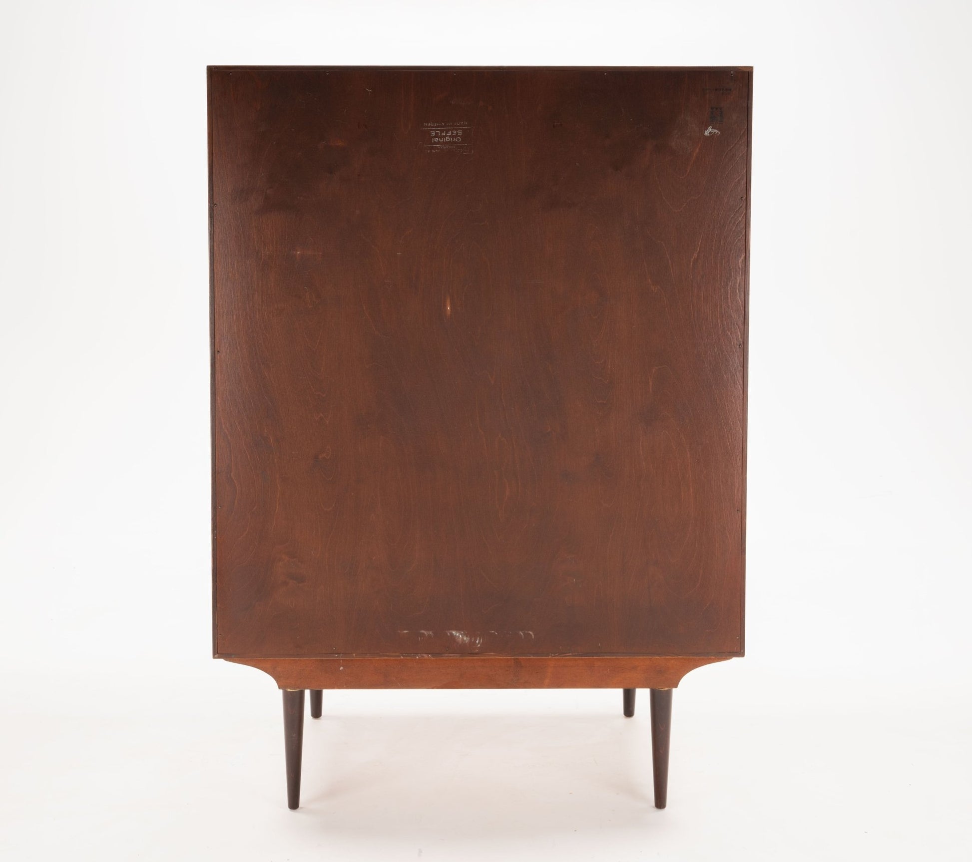 Back view of mid-century modern Svante Skogh rosewood dresser with tapered legs and simple clean lines