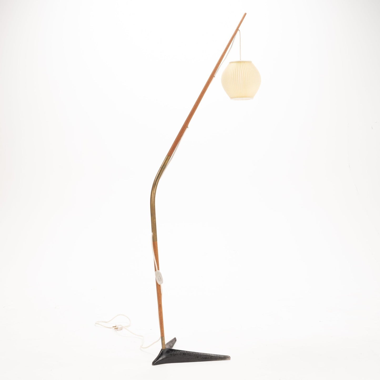 Svend Aage Holm Sorensen Floor Lamp with a long, gracefully curved wooden arm accented by brass, suspending a softly pleated cream paper lantern shade above a minimalist black metal base, showcasing vintage Danish lighting craftsmanship.