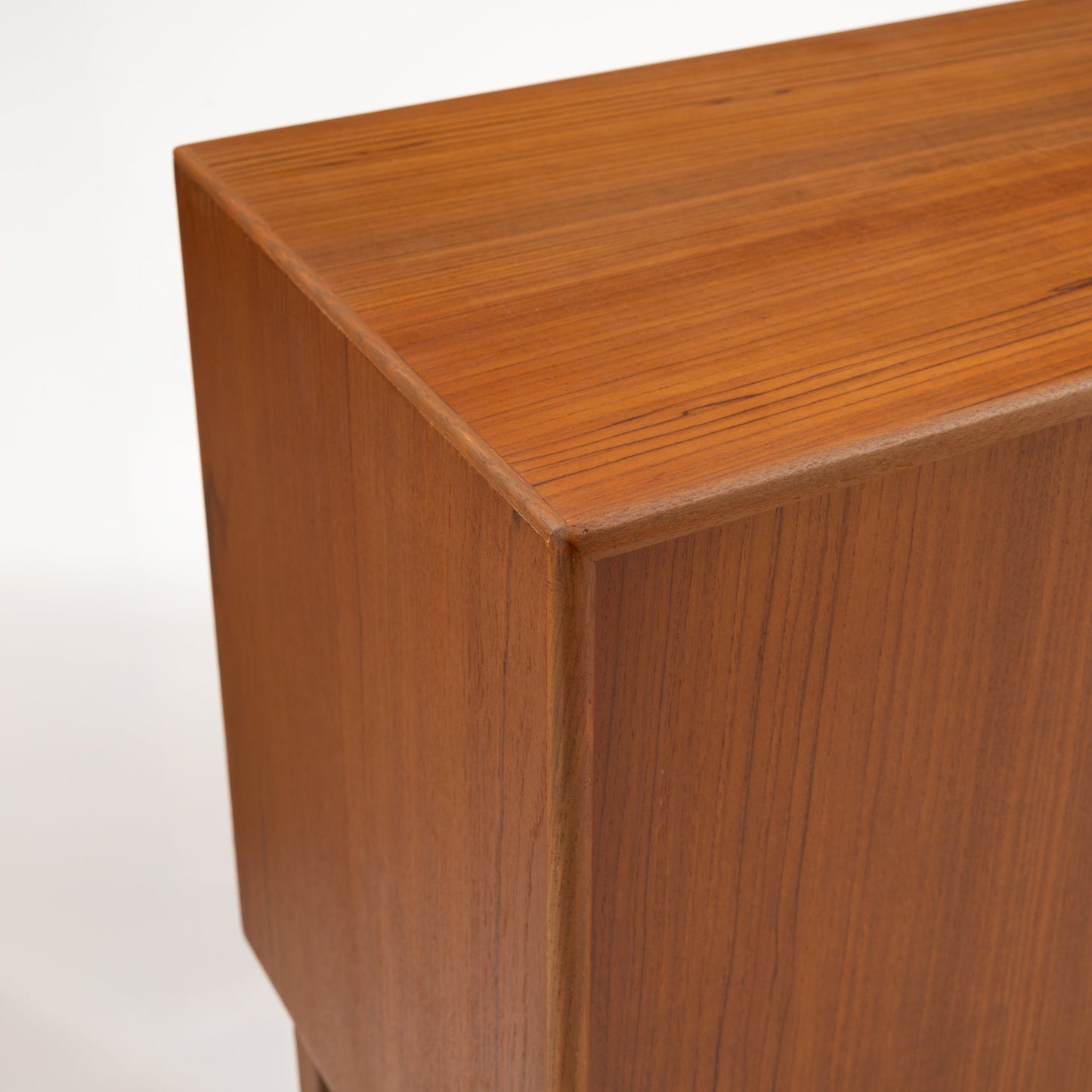 Swedish Teak Cabinet & Bookcase - Set 1 close-up highlighting the smooth, warm teak wood surface with subtle grain details and clean mid century modern lines.