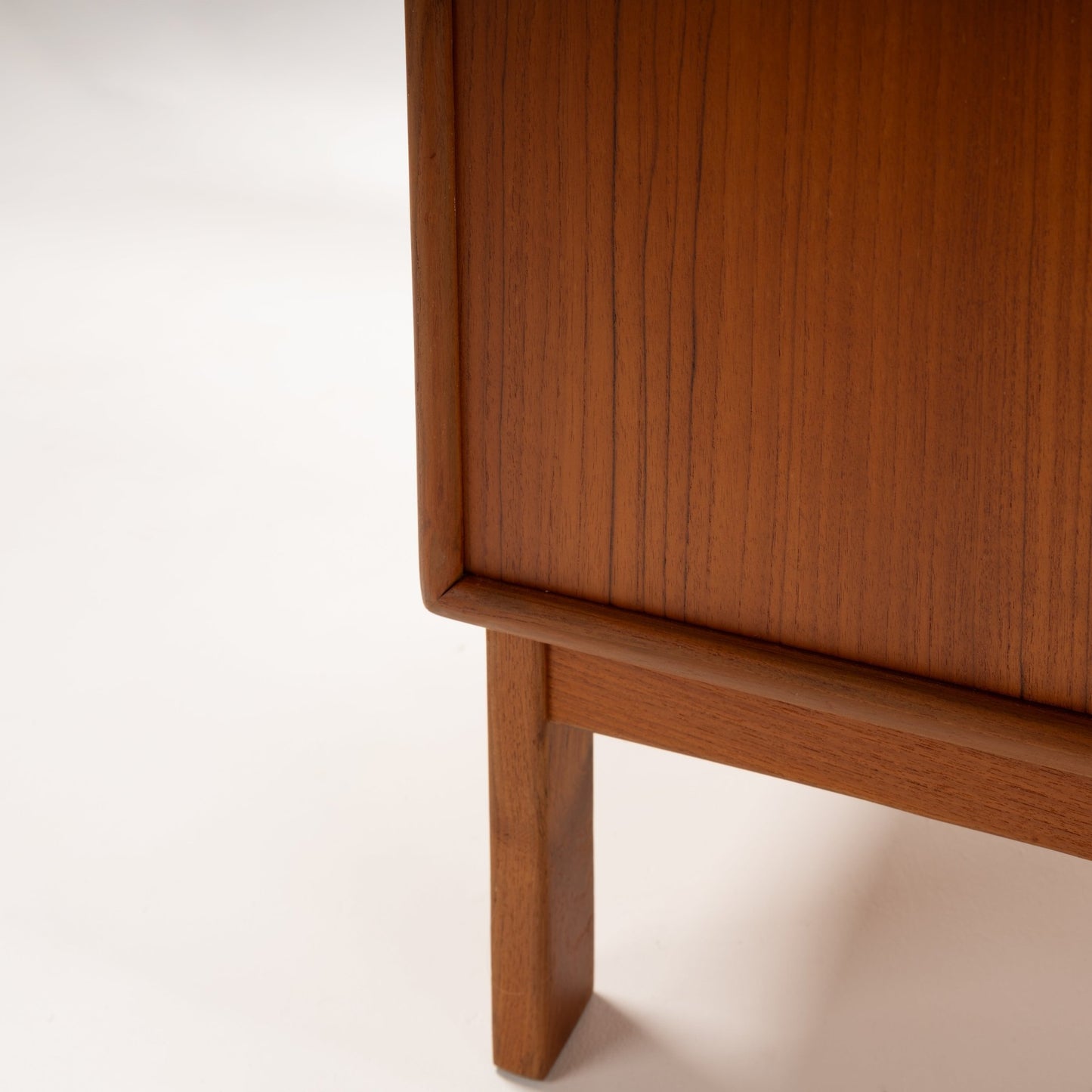 Swedish Teak Cabinet & Bookcase - Set 1 close-up showing rich teak wood grain, smooth finish, and finely crafted corner detail highlighting mid century modern furniture design.