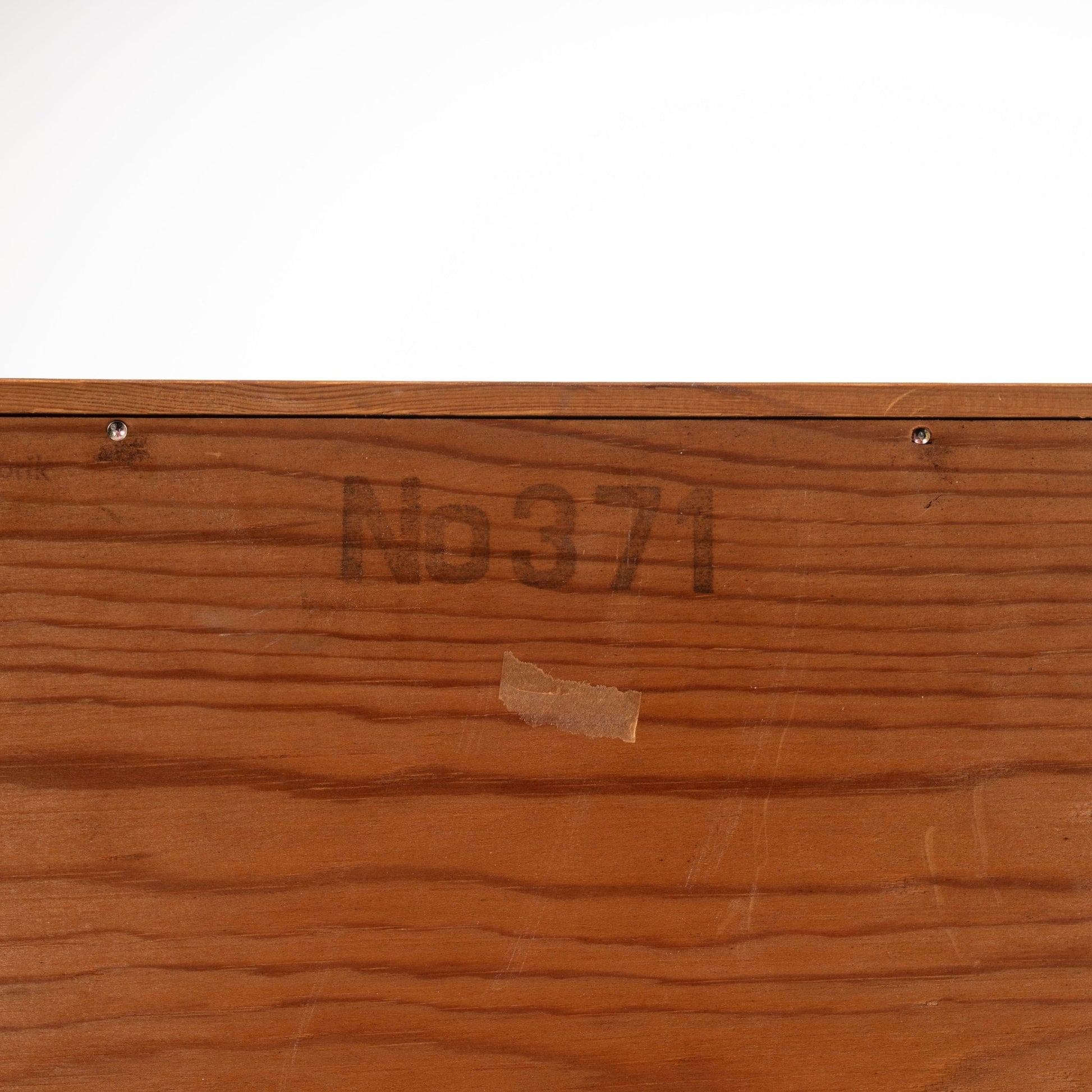 Swedish Teak Cabinet & Bookcase - Set 1 showing a close-up of the wood surface with a faded stamped number and fine teak grain, highlighting vintage mid century modern craftsmanship.