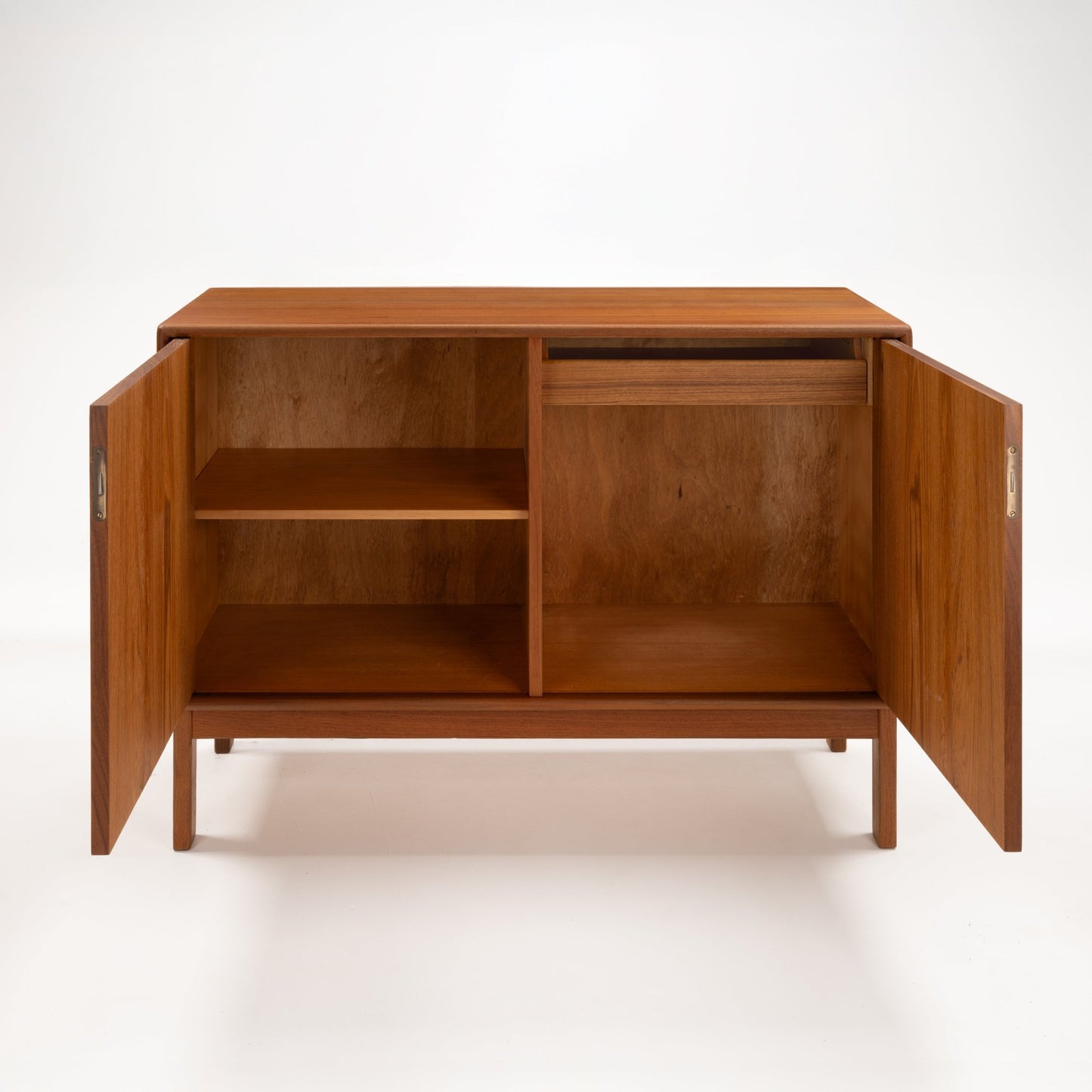 Swedish Teak Cabinet & Bookcase - Set 1 featuring a warm teak wood storage unit with double doors open to reveal divided shelving and a slim top drawer, embodying mid century modern style.