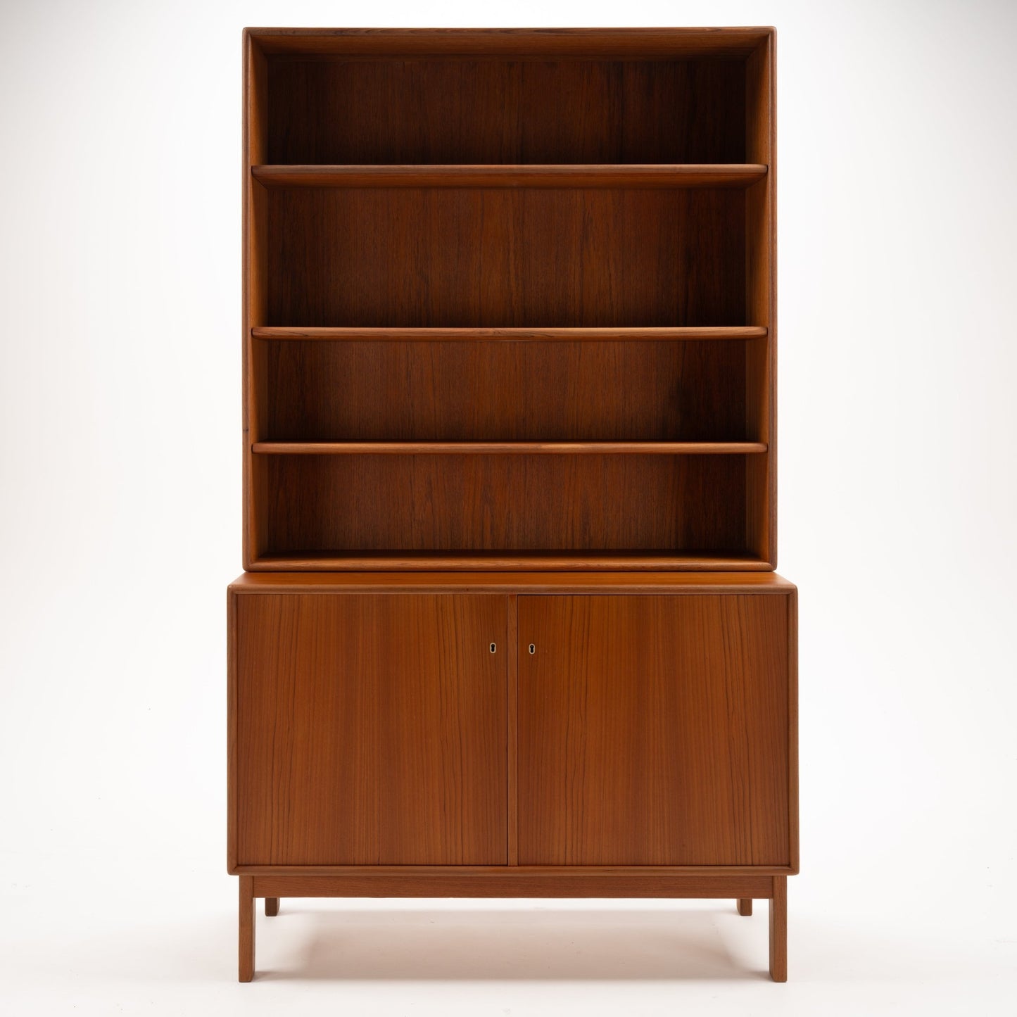 Swedish Teak Cabinet & Bookcase - Set 1 showcasing a tall, polished teak frame with four open shelves above and closed storage with doors below, reflecting classic mid century modern storage design.