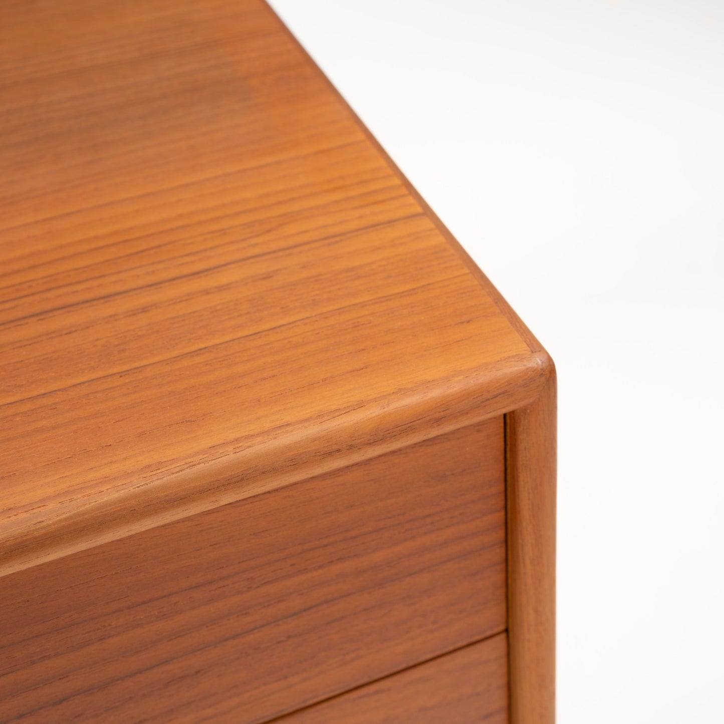 Swedish Teak Cabinet & Bookcase - Set 2 showcasing the smooth rounded corner and rich teak wood grain of a mid century modern vintage Danish storage piece.