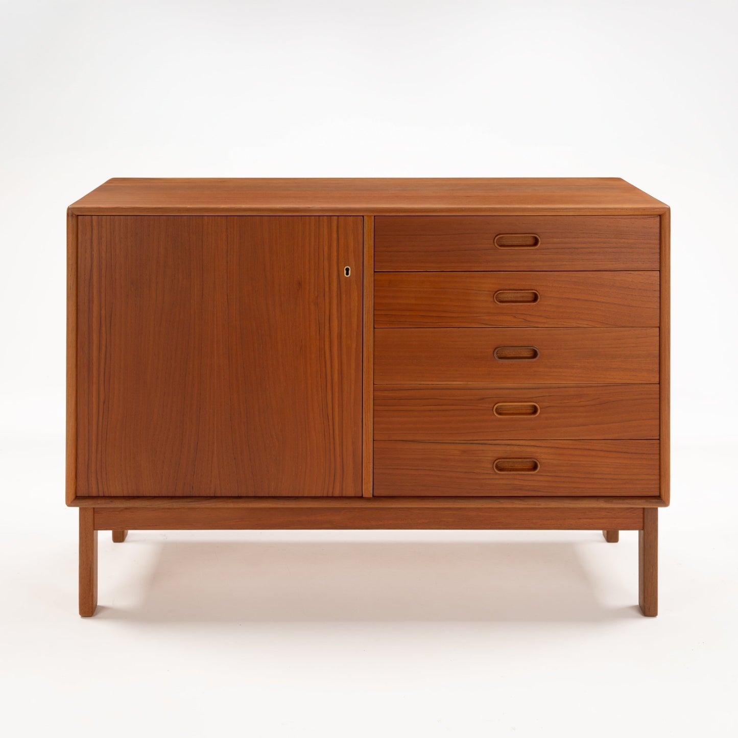 Swedish Teak Cabinet & Bookcase - Set 2 featuring a mid century modern sideboard with a large door and four drawers, crafted from warm teak wood with minimalist handles and clean lines.