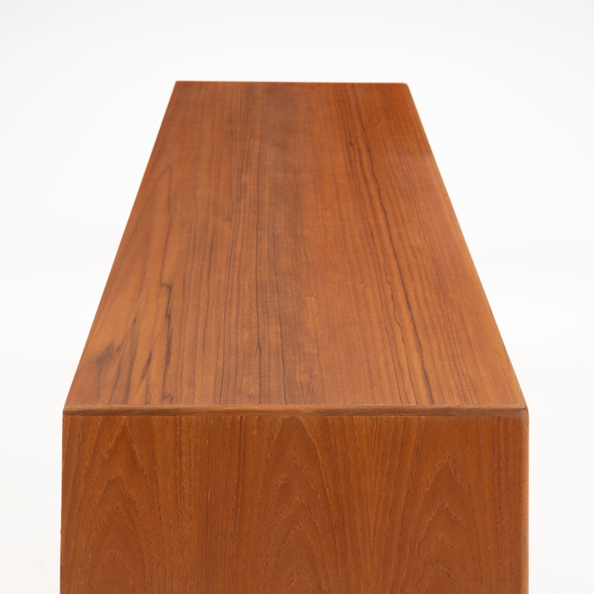 Swedish Teak Cabinet & Bookcase - Set 2 showing the smooth, polished teak wood top with distinct grain patterns highlighting vintage mid century modern Scandinavian craftsmanship.