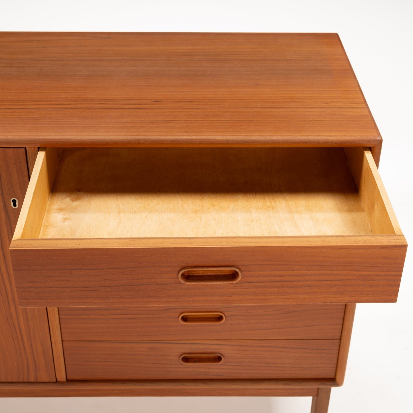 Swedish Teak Cabinet & Bookcase - Set 2 featuring an open top drawer with smooth light wood interior and recessed oval handles, highlighting mid century modern vintage Danish storage craftsmanship.