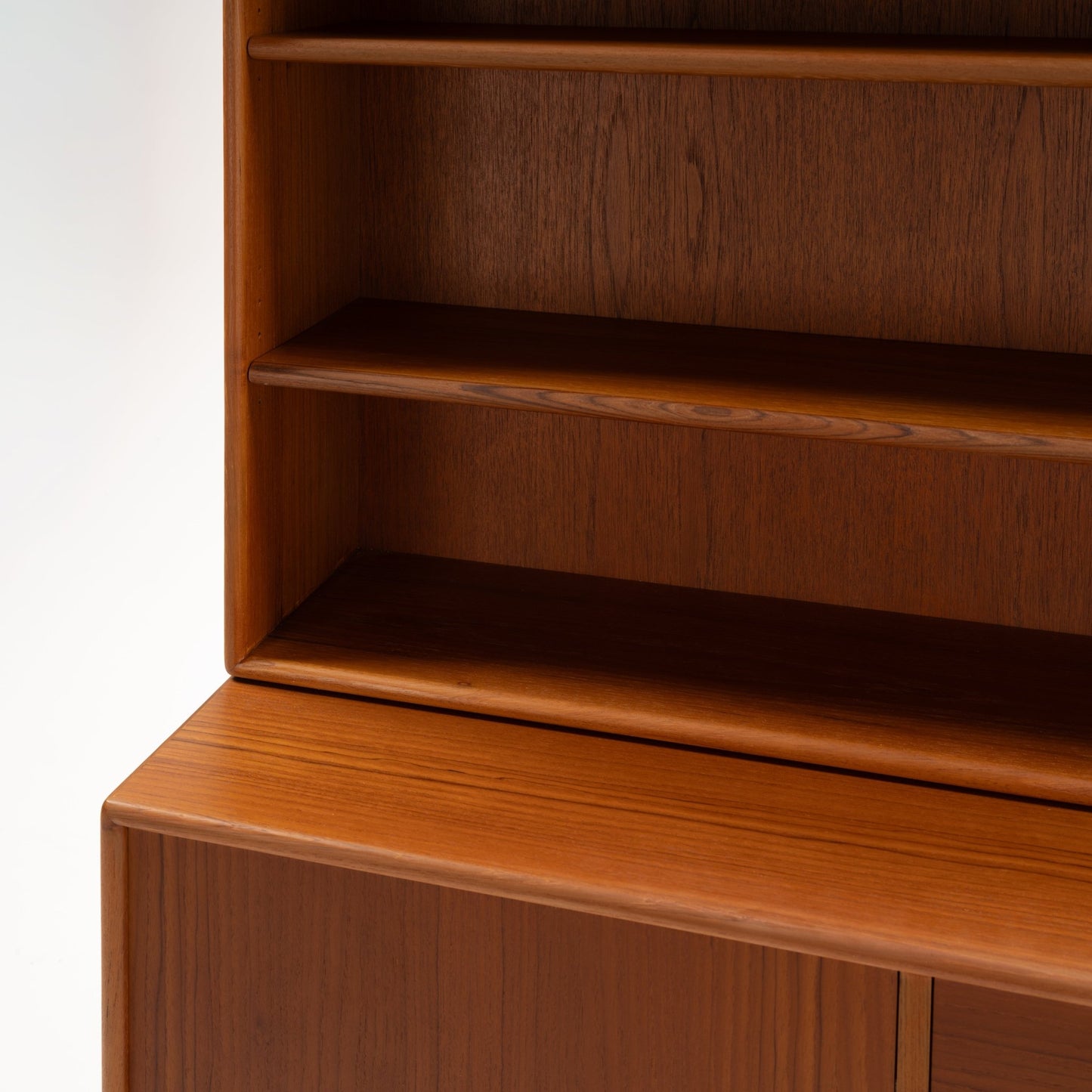 Swedish Teak Cabinet & Bookcase - Set 2 showcasing rich teak wood grain with open shelving above and a smooth surface highlighting its mid century modern vintage craftsmanship.