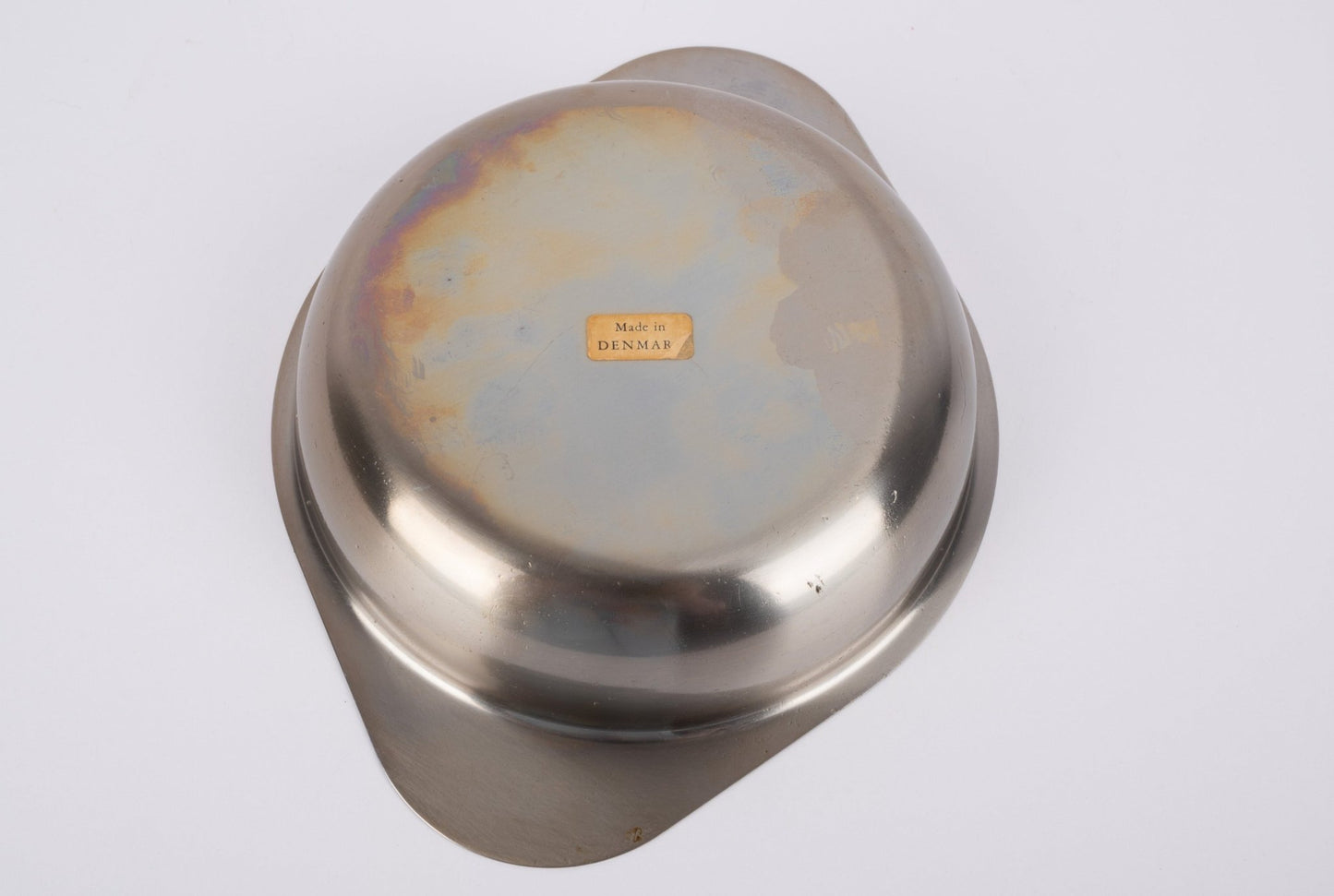Bottom view of teak ashtray stand with metal bowl showing "Made in Denmark" label on a white background